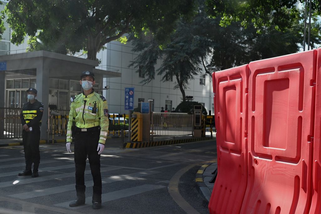 Police are pictured outside the Yantian District Peoples Court, where 12 Hong Kong pro-democracy activists who were arrested last August as they tried to flee Hong Kong to Taiwan by boat will face trial, in China's southeastern city of Shenzhen, across the border from Hong Kong, on Dec. 28, 2020. (Noel Celis—AFP/Getty Images)
