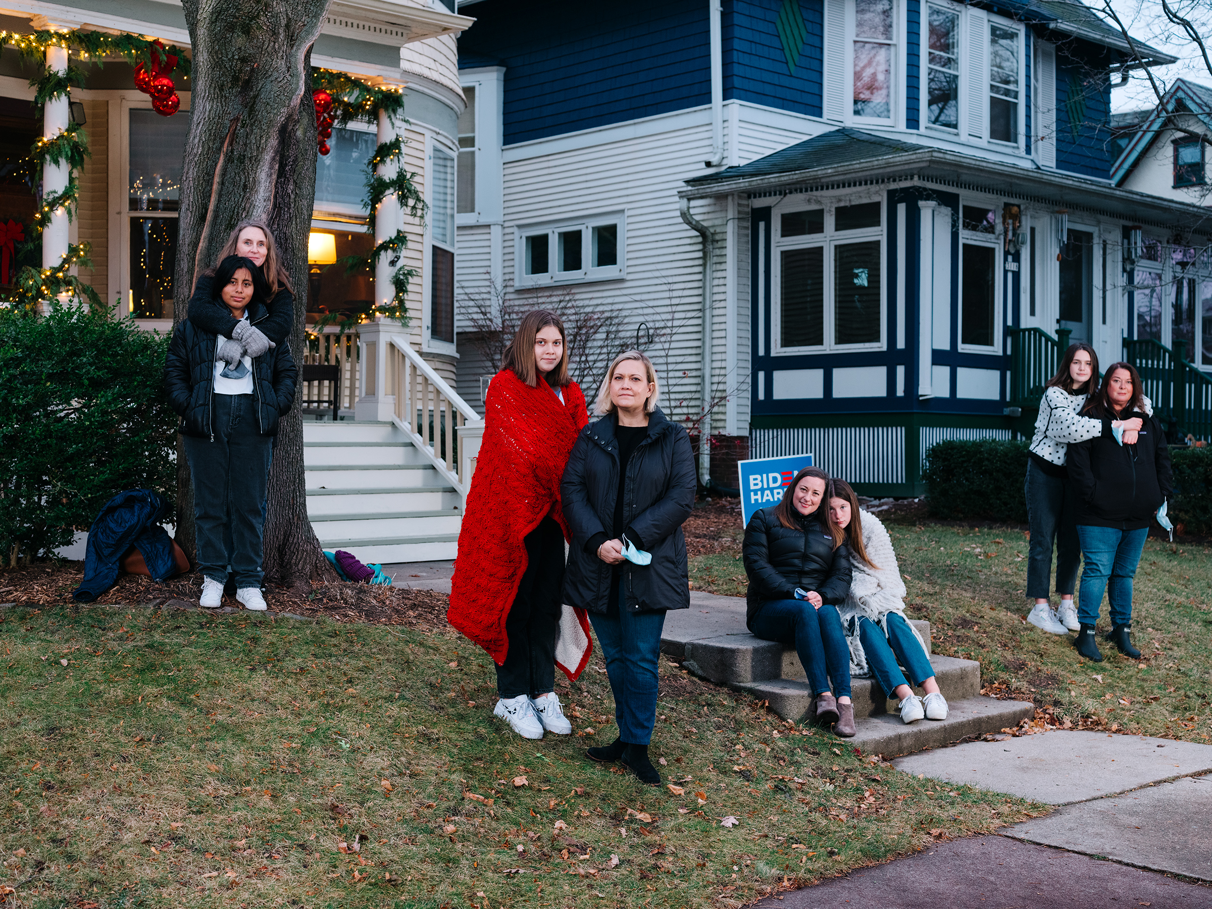 Biden/Harris supporters (from left) Lorna Dilley and Faith Coffaro, Maggie and Carrie Killoran, Caroline Cahill and Eileen Force Cahill, and Alice Stephens and Lulu Rorabeck, on Milwaukee's East Side on Dec. 5, 2020. (David Kasnic for TIME)