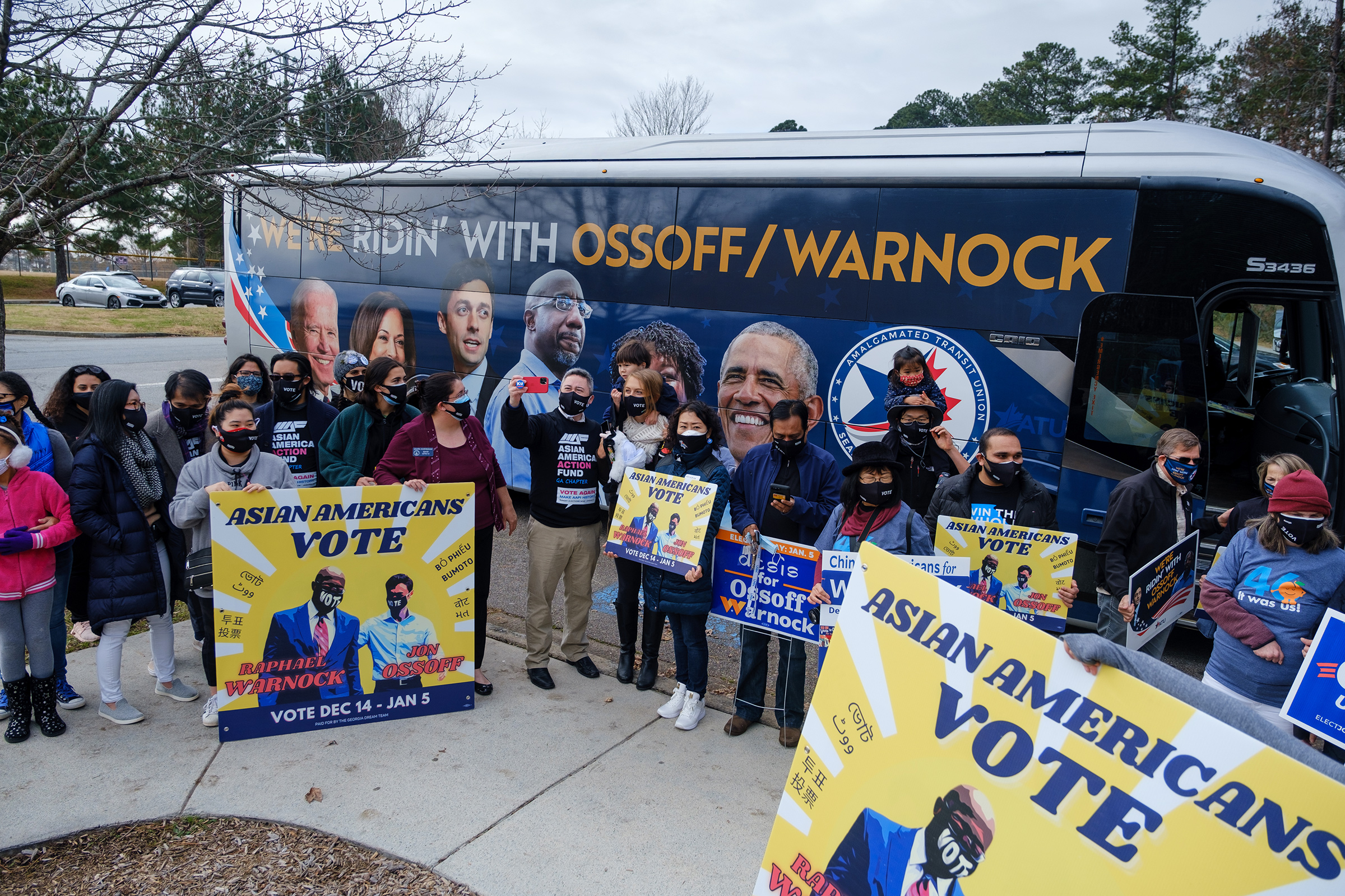 Supporters of Democratic senate candidates Rev. Raphael Warnock and Jon Ossoff gather at Shorty Howell Park in Duluth, Georgia on Dec. 20 for a 