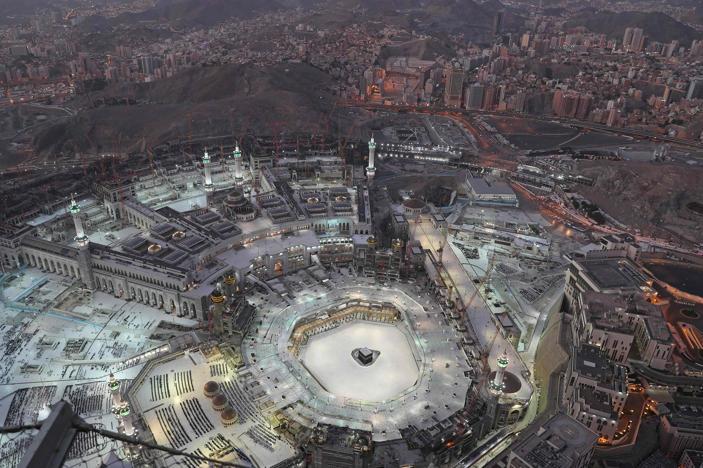 An eerie emptiness enveloped the area surrounding the Kaaba in Mecca's Grand Mosque, Islam's holiest site, on March 6, as attendance at Friday prayers was hit by measures to protect against COVID-19. (Bandar al-Dandani—AFP/Getty Images)