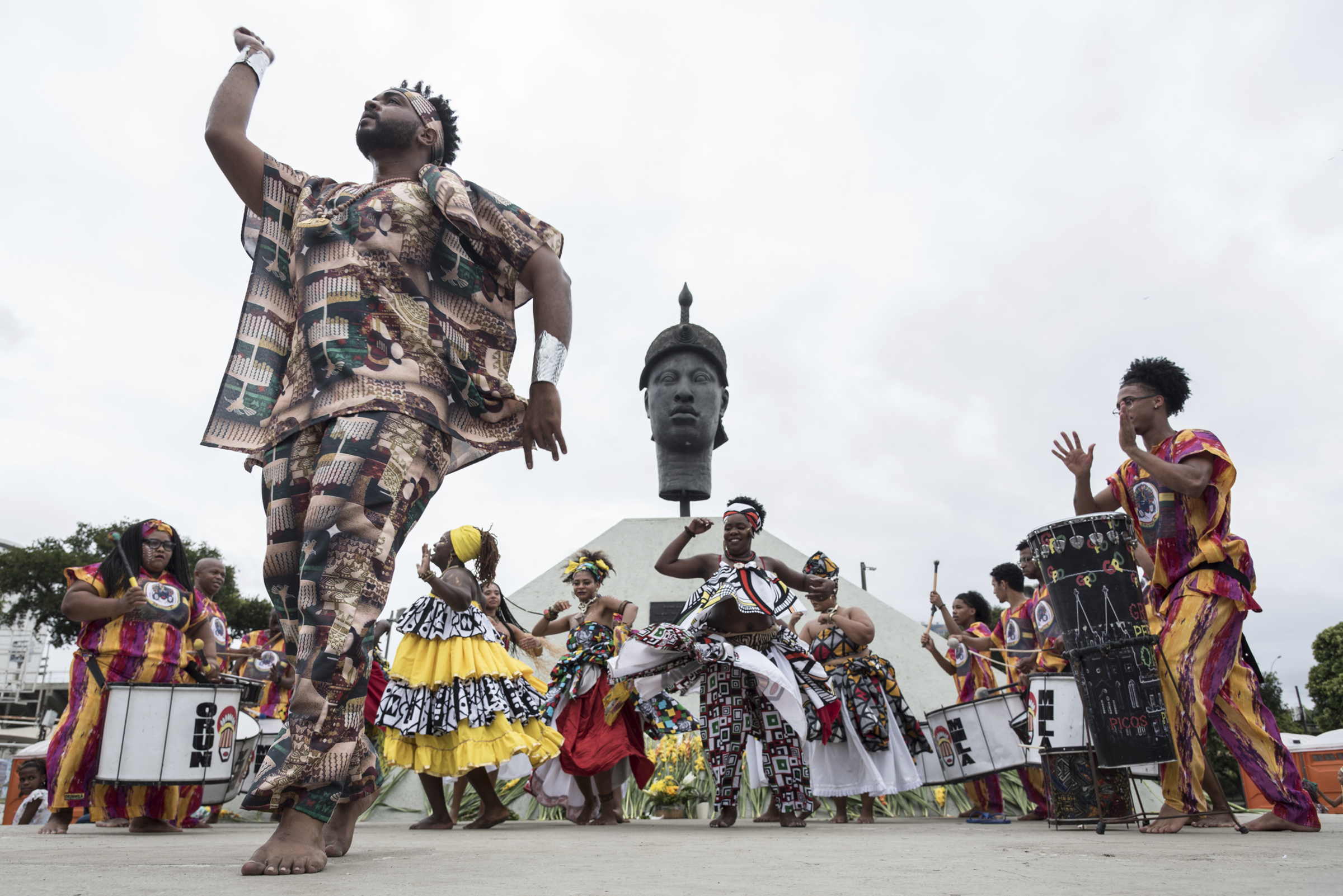 A man dances at a Black Awareness Day event in front of the monument honoring Zumbi dos Palmares, quilombo leader and symbol of the fight against slavery in Brazil, in Rio de Janeiro on Nov. 20, 2019. (Barbara Dias—AGIF/AP)
