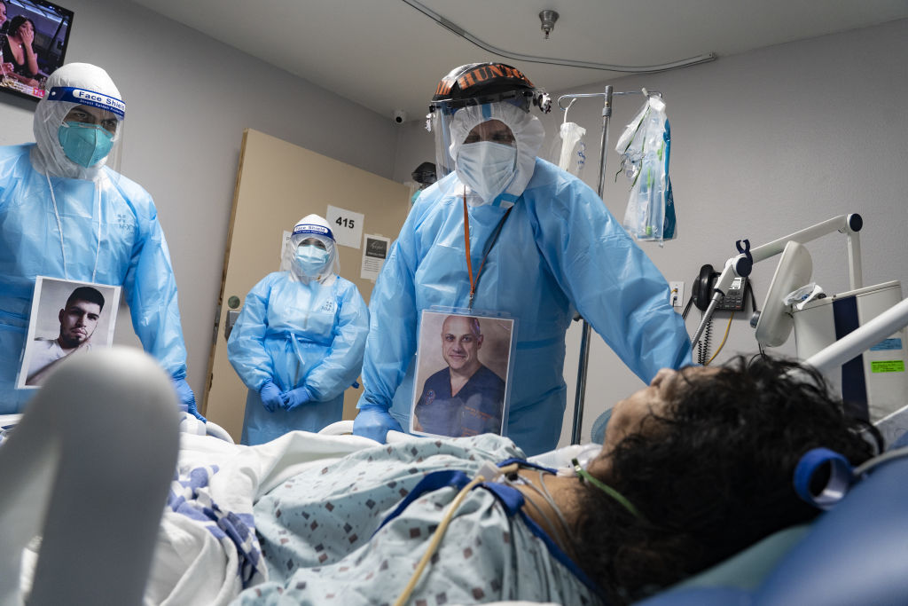 Medical staff members check on a patient at the COVID-19 Intensive Care Unit (ICU) of United Memorial Medical Center in Houston, Texas, on Nov. 8, 2020. (Go Nakamura/Bloomberg—Getty Images)