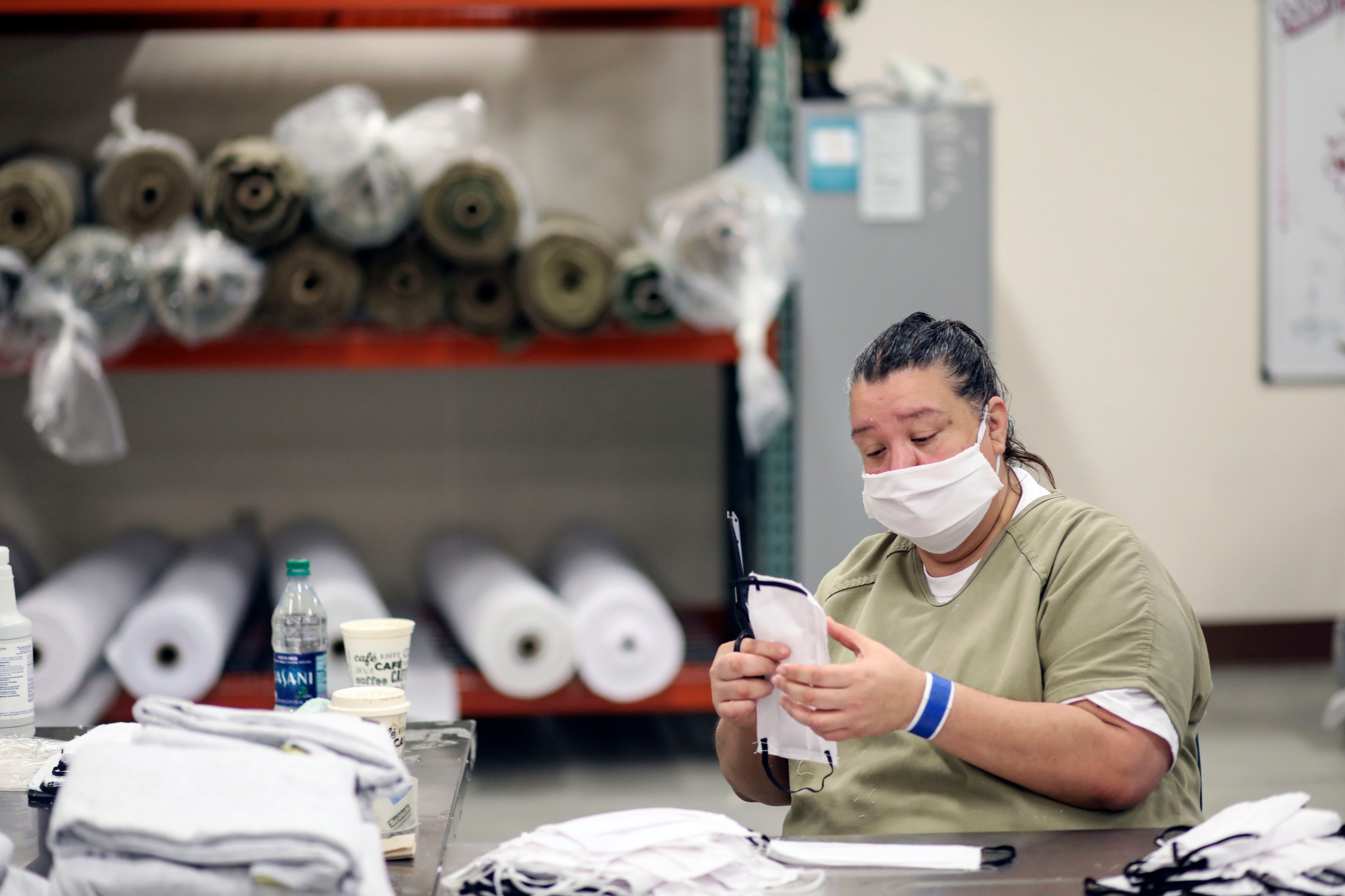 An inmate sews protective masks at Las Colinas Women's Detention Facility in Santee, California, on April 22, 2020. (Sandy Huffaker—AFP/Getty Images)