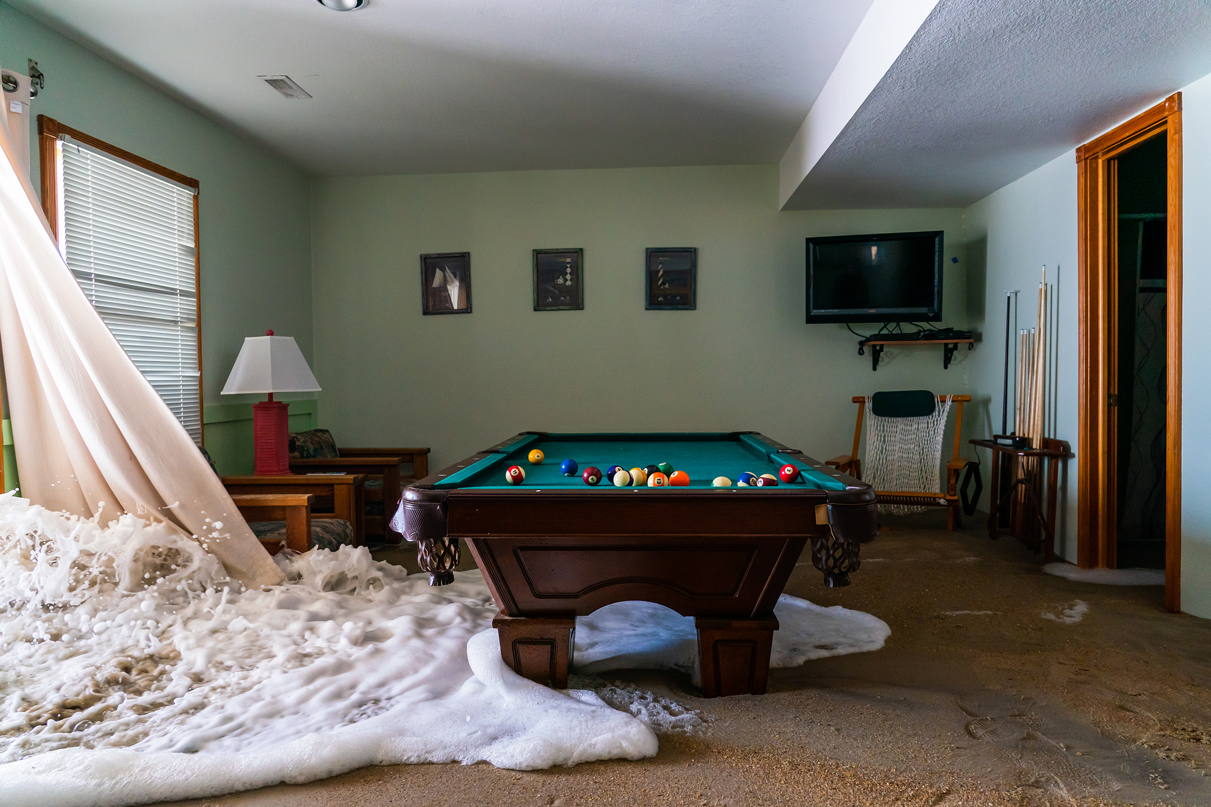 The Atlantic Ocean surges its way into a rental beach house in Avon, N.C., on Sept. 22. Hurricane Teddy was spinning just off the coast, causing higher than normal tides and tidal surges that were inundating lower-lying homes and rental properties.
