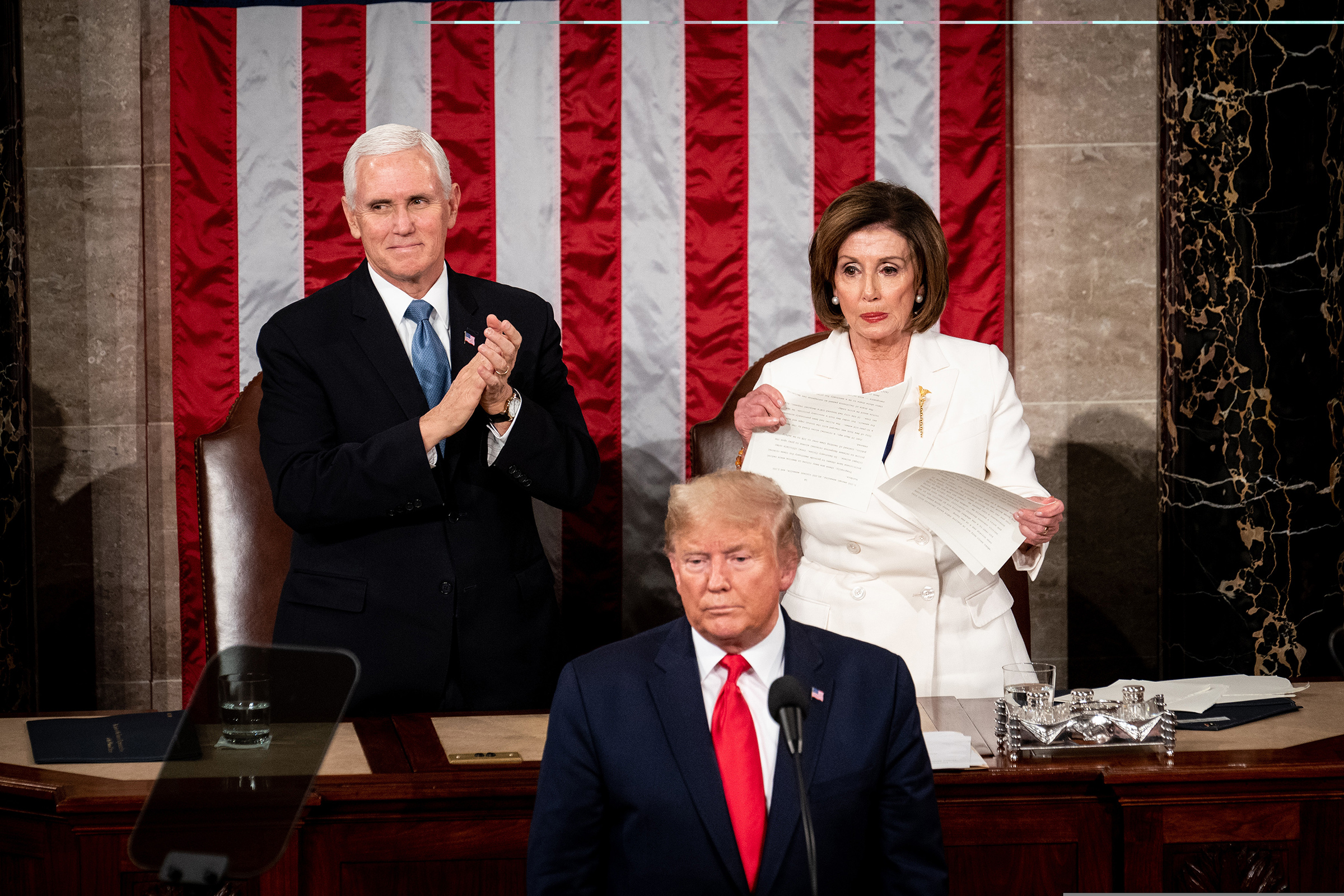 As Vice President Mike Pence applauds, House Speaker Nancy Pelosi rips up her copy of President Trump's State of the Union address following his speech at the Capitol in Washington, D.C., on Feb. 4. (Erin Schaff—The New York Times/Redux)