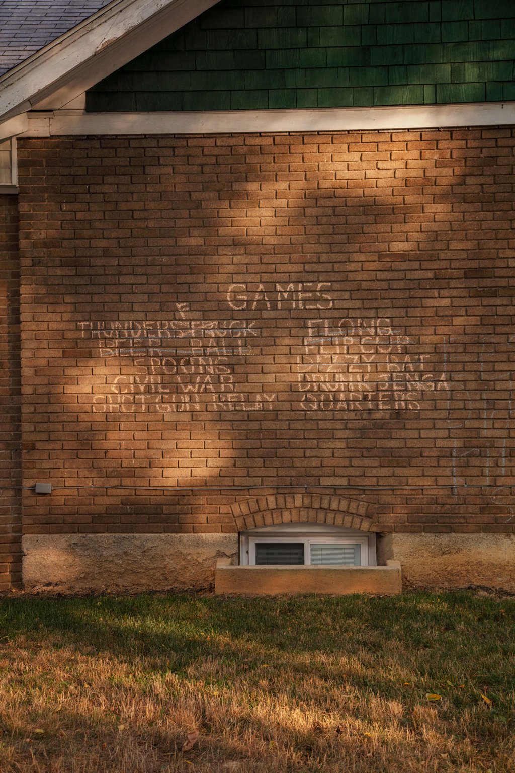 A list of drinking games on the side of a house in State College, Pa. The typically bustling main campus of Pennsylvania State University was quieter than normal.