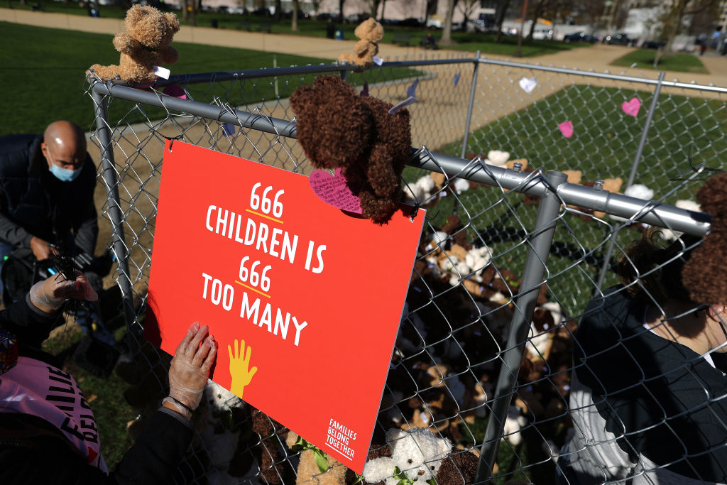 Volunteers from pro-immigration group Families Belong Together build and fill a chainlink cage with about 600 teddy bears 'representing the children still separated as a result of U.S. immigration policies' on the National Mall November 16, 2020 in Washington, DC. (Chip Somodevilla/Getty Images)