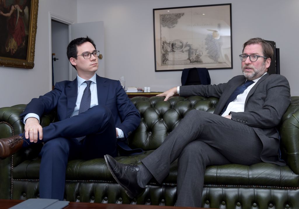 President Fabien Lehagre, left, and lawyer Patrice Spinosi of 'Association des Americains Accidentels' (AAA) are pictured during an interview with AFP in Paris on December 7, 2017. (Eric Piermont—AFP/Getty Images)