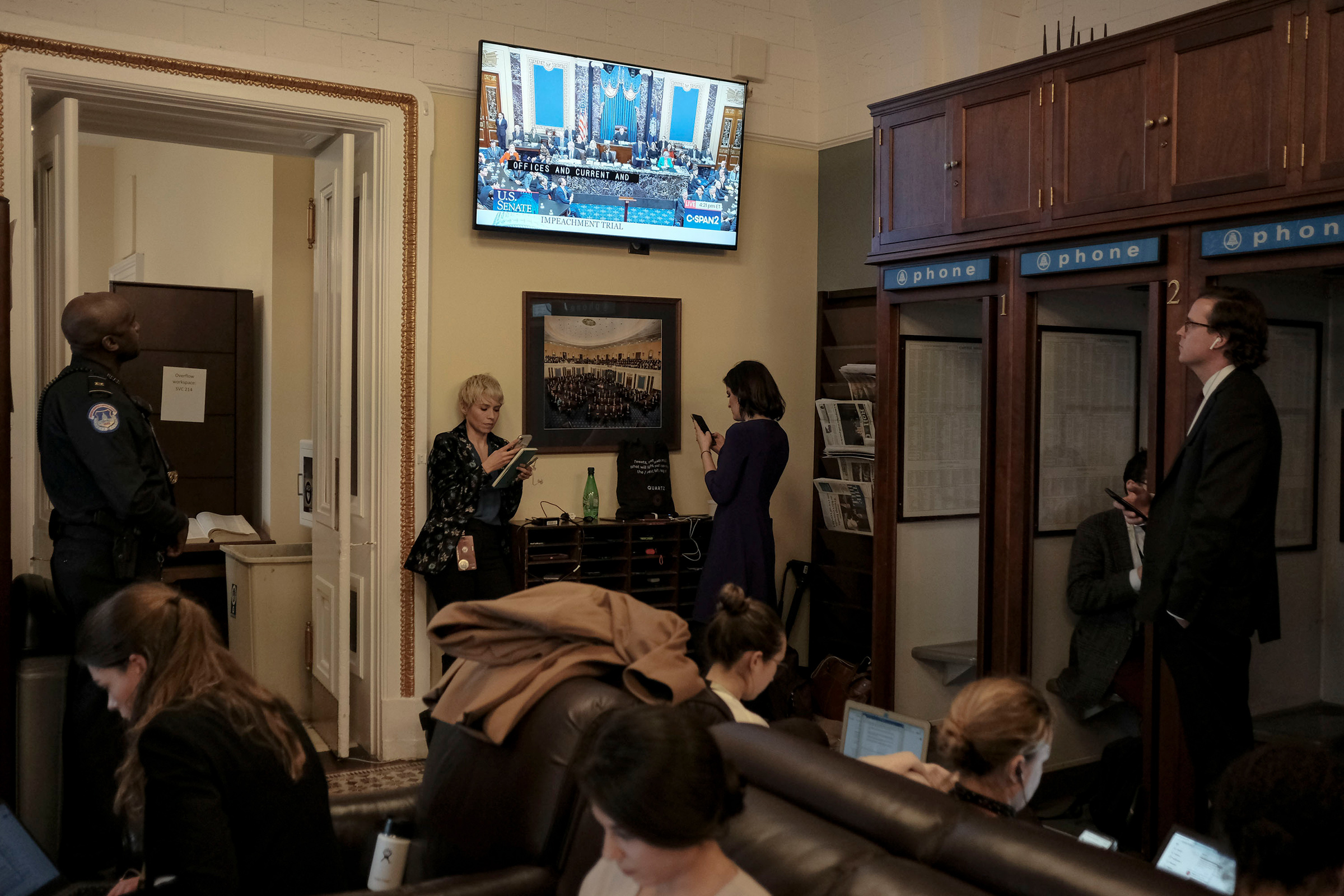 Reporters watch the Senate impeachment vote in the press gallery at the Capitol in Washington, D.C., on Feb. 5, 2020.