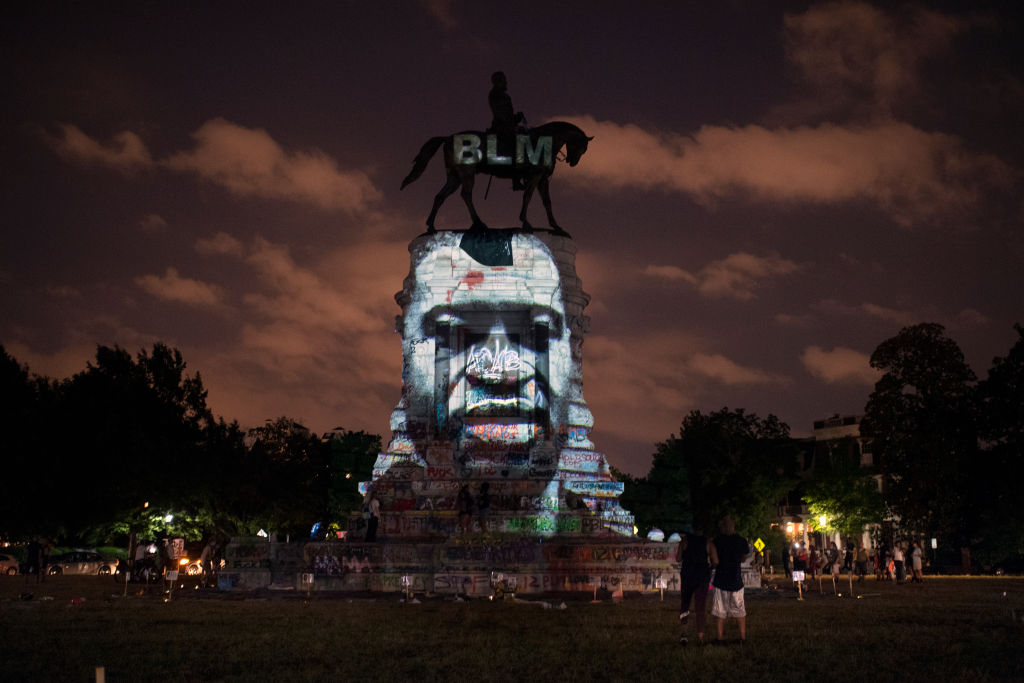 The image of George Floyd along with the Black Lives Matter letters are projected onto the Robert E. Lee Statue on Monument Avenue in Richmond, Virginia, on June 10, 2020. (John McDonnell/The Washington Post—Getty Images)