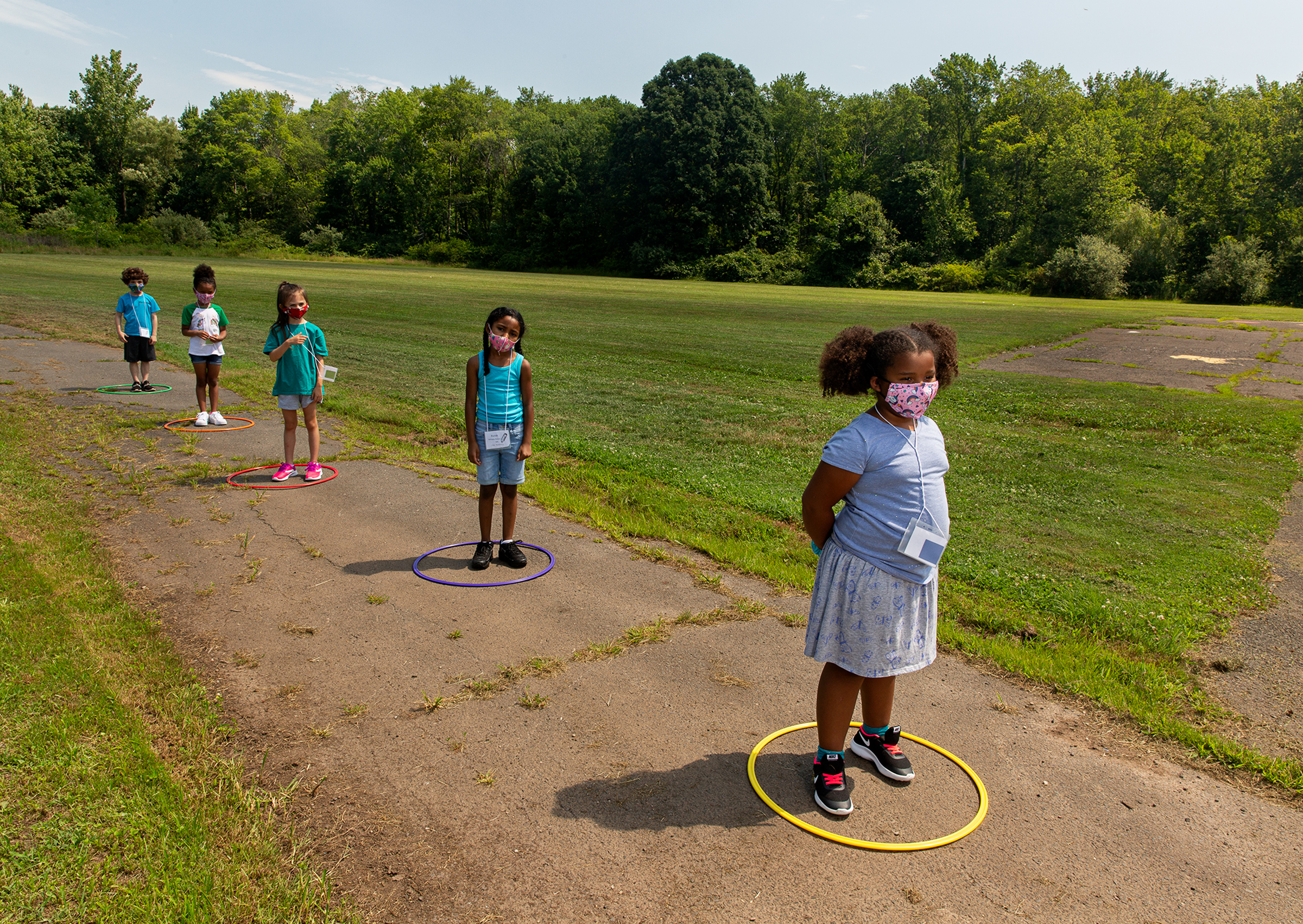 Children line up for school at Wesley Elementary in Middle­town, Conn., on July 20.