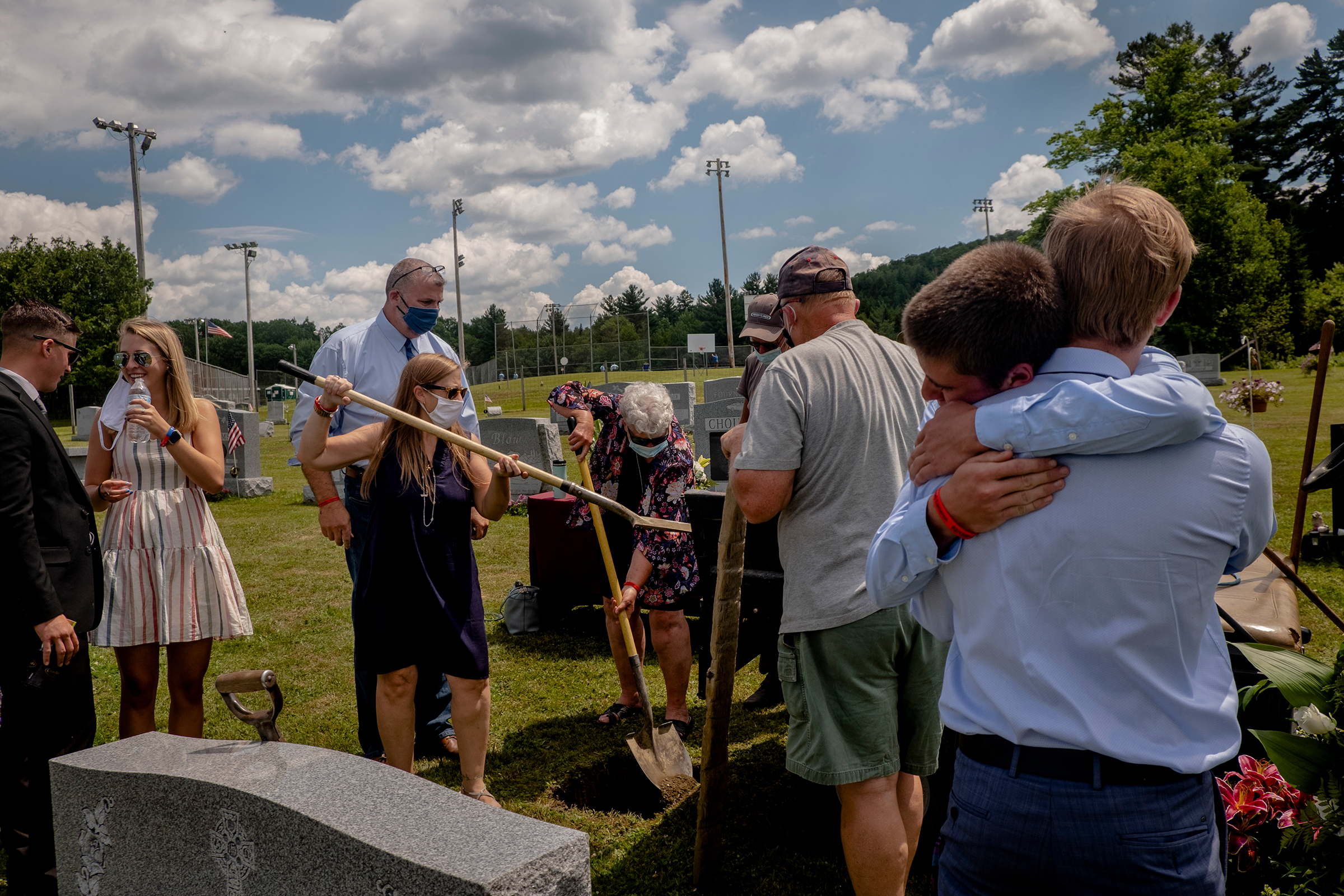 The family and friends of Jefrey Scott Cameron, who died of an accidental overdose earlier this year, at his burial in Barre, Vt., on July 18. By this time, more than 40 states had seen increases in overdoses since the onset of the pandemic in the U.S. (Hilary Swift—The New York Times/Redux)