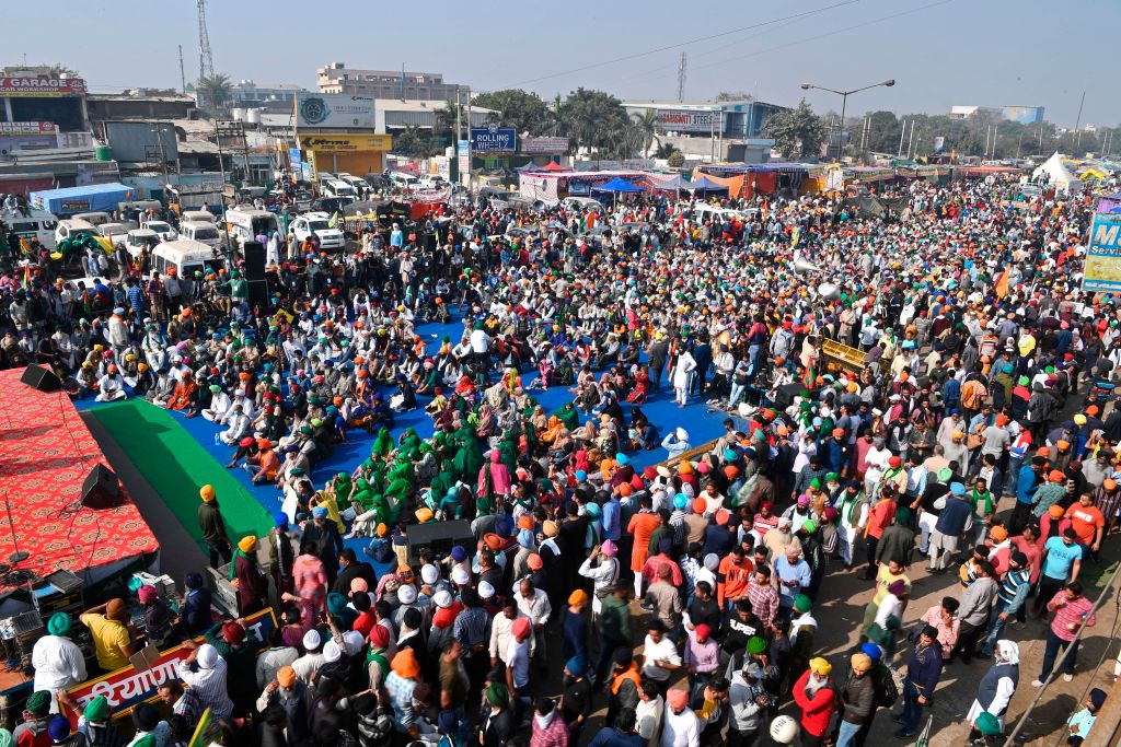 Farmers gather as they take part in a nationwide general strike to protest against the recent agricultural reforms at the Delhi-Haryana state border in Singhu on December 8, 2020. (Sajjad HUSSAIN / AFP via Getty Images)