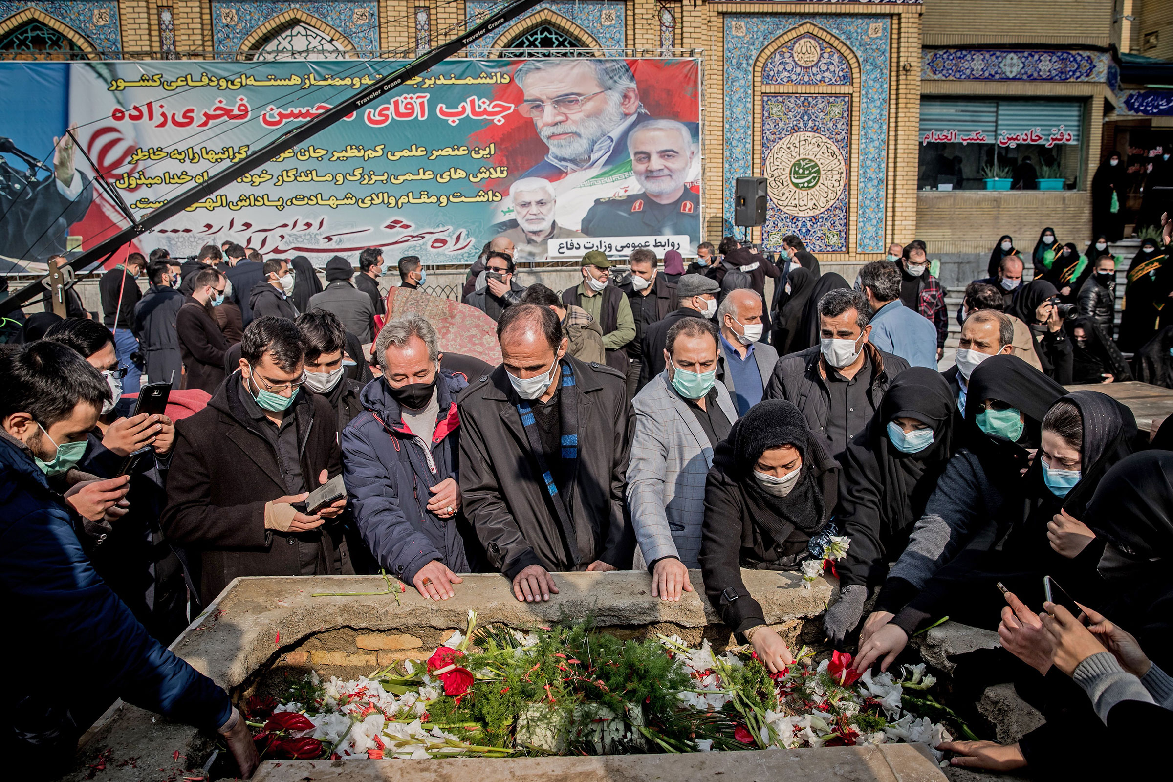 Iranian mourners attend the burial ceremony of slain nuclear scientist Mohsen Fakhrizadeh at Imamzadeh Saleh shrine in northern Tehran, on Nov. 30, 2020. (Hamed Malekpour—Tasnim News/AFP/Getty Images)