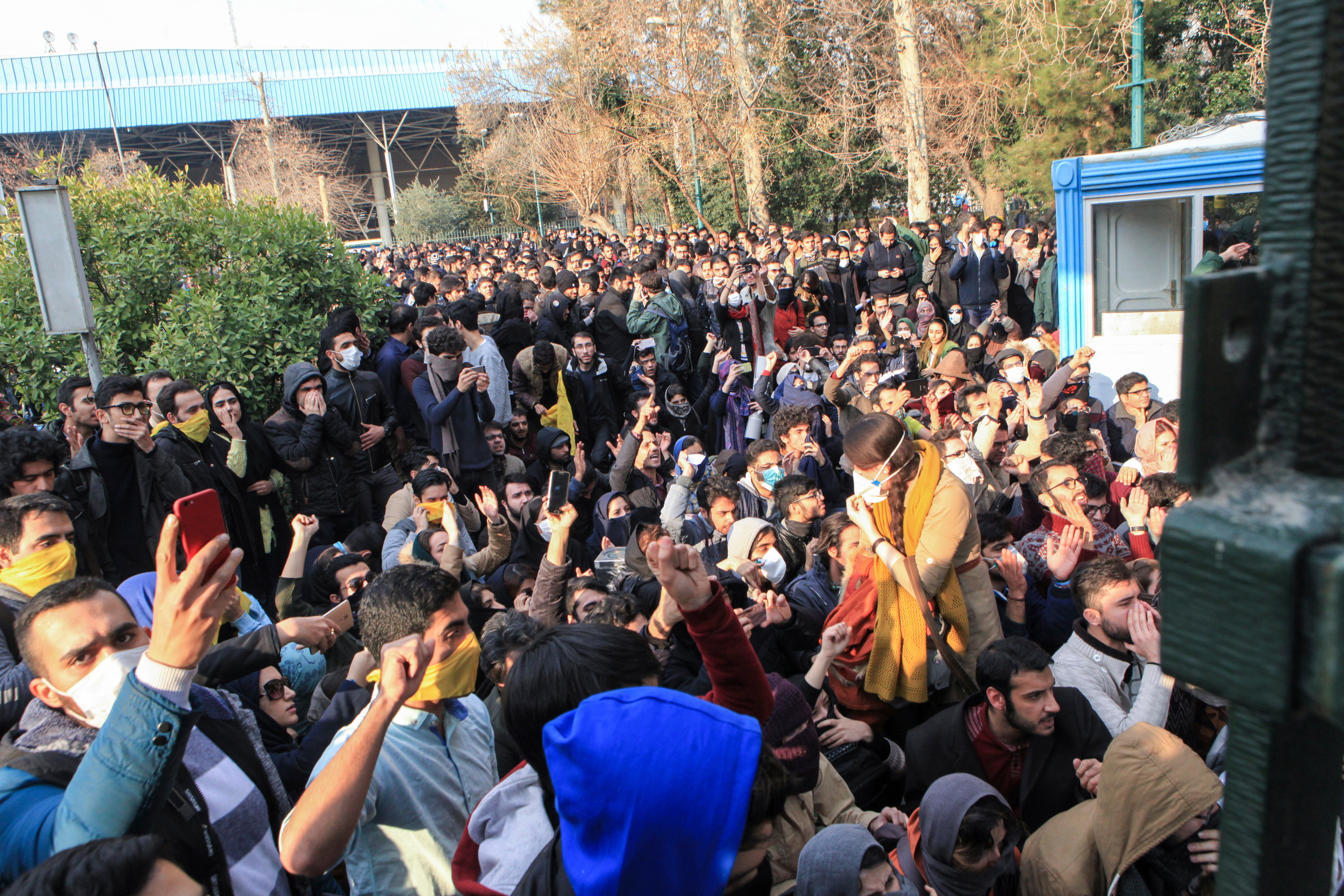 In this Saturday, Dec. 30, 2017 file photo, university students attend a protest inside Tehran University in Iran. A channel on a mobile messaging app run by exiled journalist Roohallah Zam helped fan the passions of some of those who took to the street. Zam was kidnapped by Iranian operatives—apparently from neighboring Iraq—imprisoned and then hanged on Dec. 12, 2020. (AP Photo)