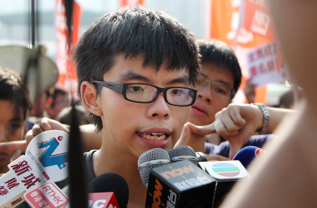 Scholarism convenor Joshua Wong Chi-fung speaks to the media after the group was barred attending the flag raising ceremony on the 64th anniversary of Chinese National Day, at Golden Bauhinia Square in Wan Chai. 01OCT13