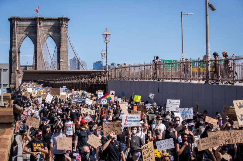 Thousands of protesters walk across the Brooklyn Bridge on  Juneteenth,  June 19, 2020, as part of one of the many protests against police brutality and in support of the Black Lives Matter movement that have taken place in 2020.