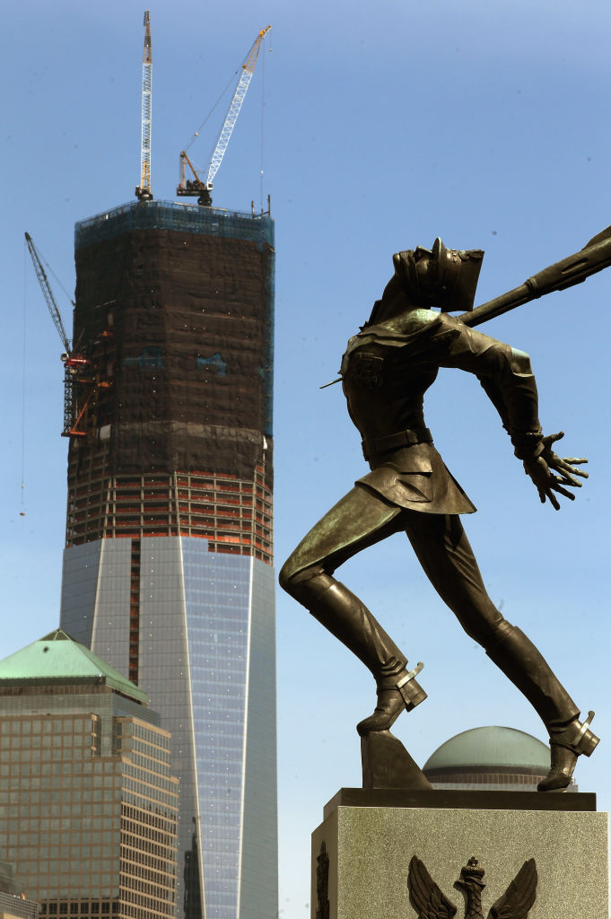 The Katyn monument is seen in Exchange Place as construction continues on One World Trade Center in the distance, on April 30, 2012, as seen from Jersey City, N.J. (Mario Tama—Getty Images)