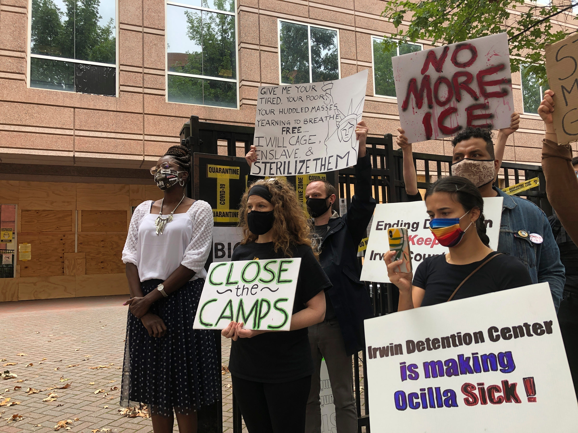 Dawn Wooten, left, a nurse at Irwin County Detention Center in Ocilla, Ga., speaks at a news conference in Atlanta protesting conditions at the immigration jail, on Sept. 15.