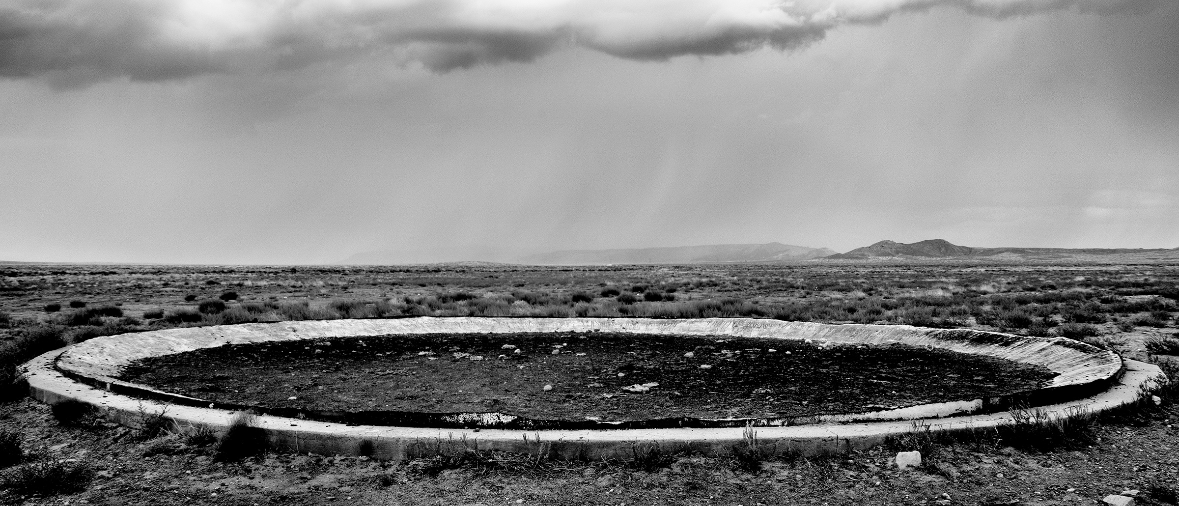The <a href="https://time.com/longform/clean-water-access-united-states/" target="_blank" rel="noopener noreferrer">remains of a water­-storage tank</a>, razed because of uranium contamination, in Red Mesa, Ariz.; for decades during the Cold War, mines in the Navajo Nation produced the uranium used for nuclear weapons. (Matt Black—Magnum Photos for TIME)