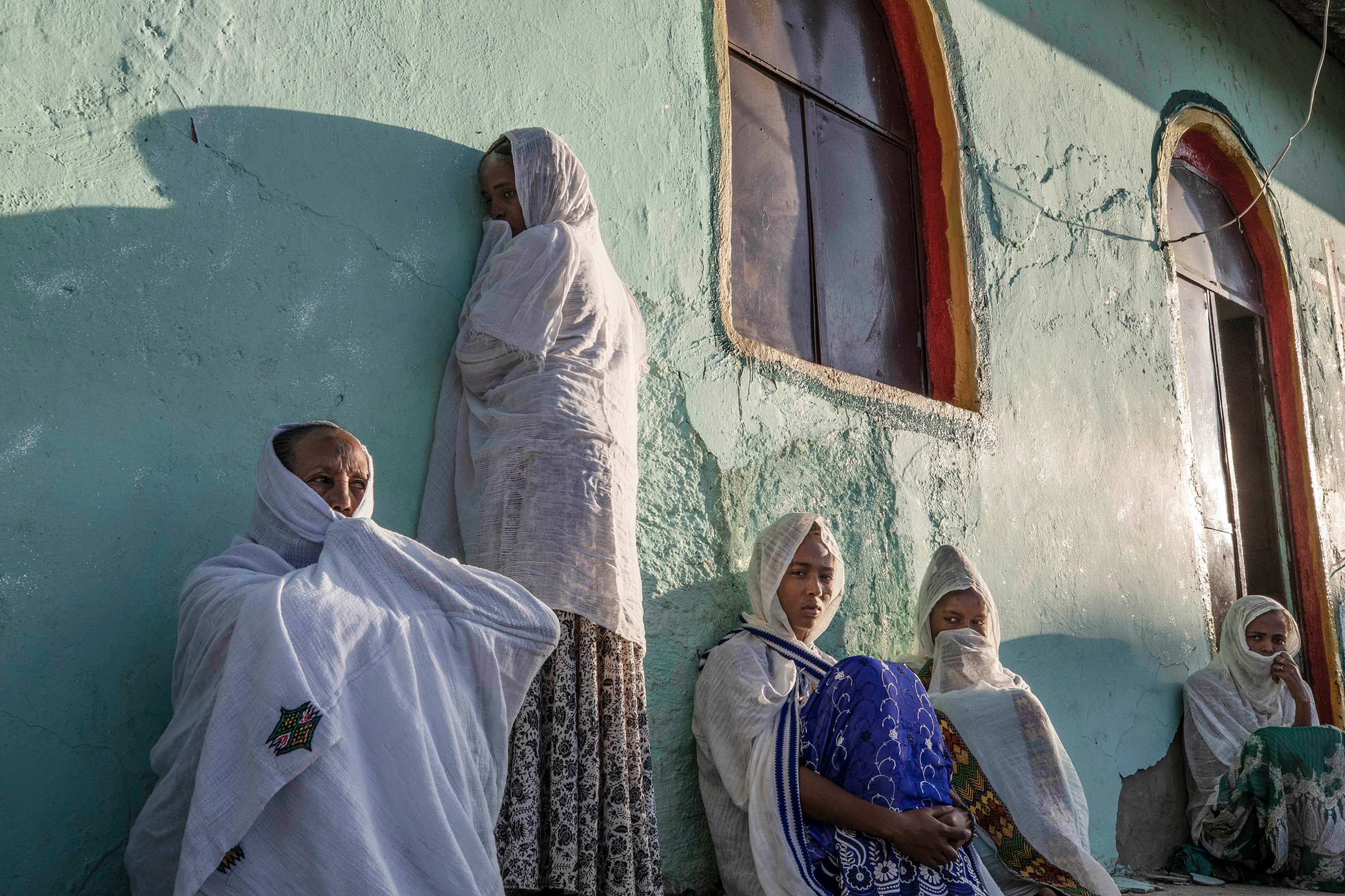 Women who fled the conflict in Ethiopia's Tigray region pray during Sunday Mass at a church near Umm Rakouba refugee camp in Qadarif, eastern Sudan, on Nov. 29. (Nariman El-Mofty—AP)
