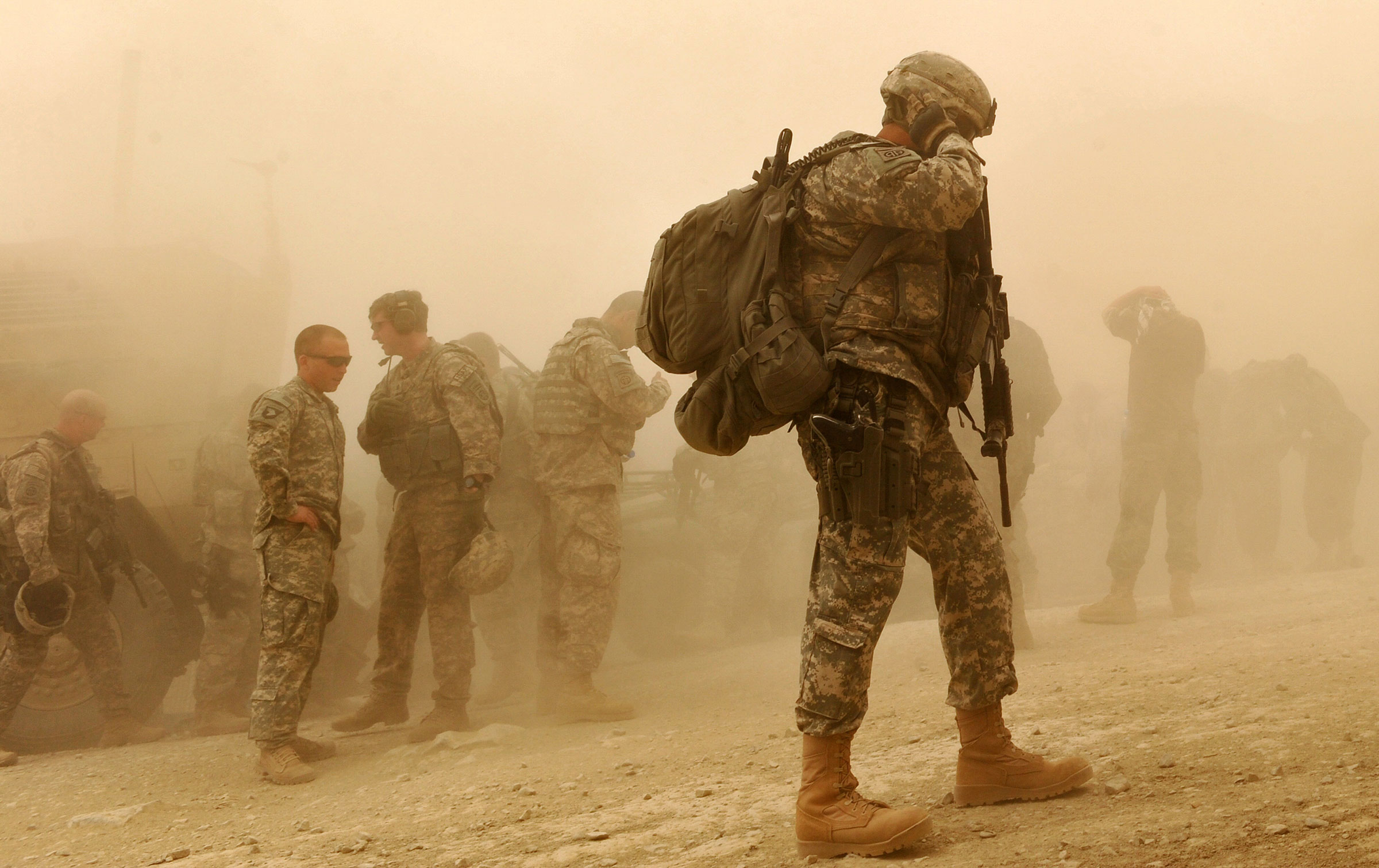 US Army soldiers walk at US military Camp Wilderness in Khost province, Afghanistan on April 10, 2010. (Massoud Hossaini—AFP/Getty Images)