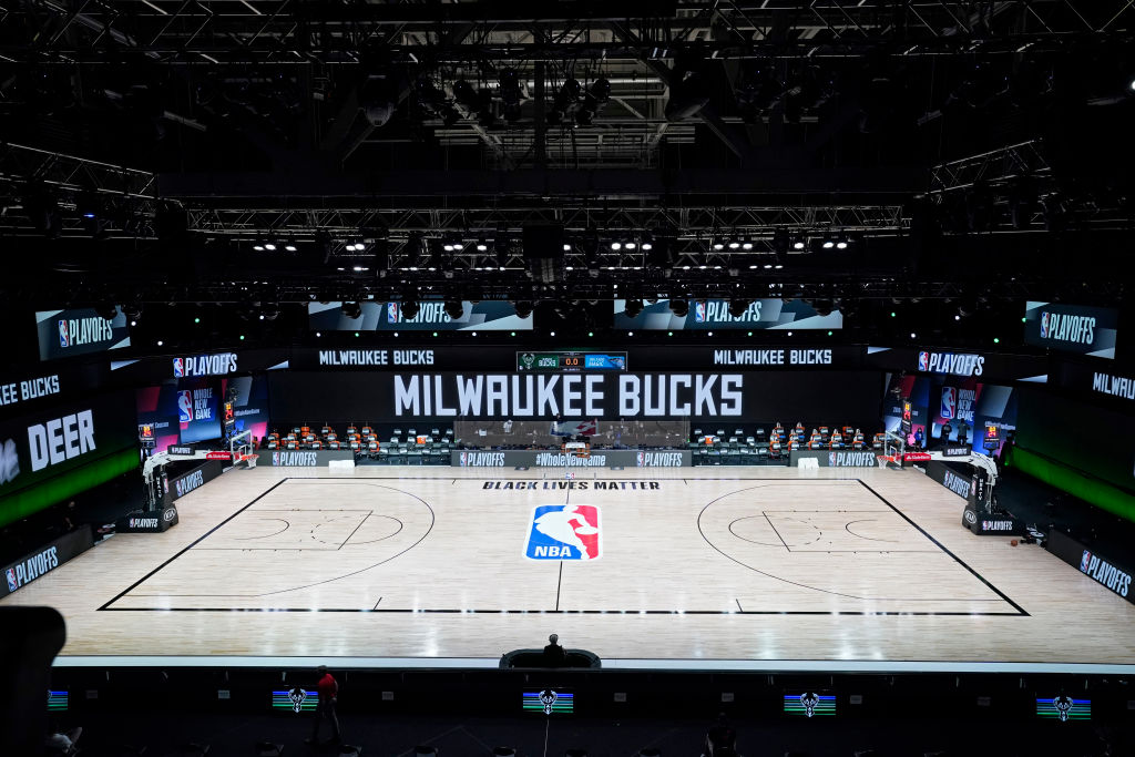 The court and benches are empty after the scheduled start of game five between the Milwaukee Bucks and the Orlando Magic in the first round of the 2020 NBA Playoffs at AdventHealth Arena at ESPN Wide World Of Sports Complex on August 26, 2020 in Lake Buena Vista, Florida. (Ashley Landis-Pool—Getty Images)