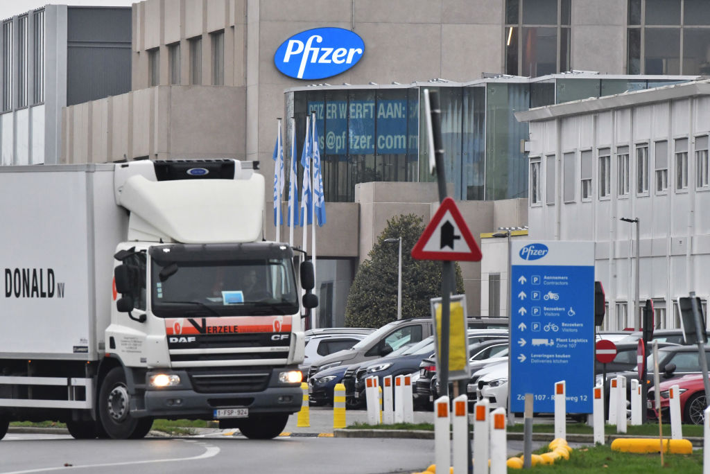 A temperature controlled cold storage haulage truck leaves the Pfizer Inc. facility in Puurs, Belgium, on Thursday, Dec. 3, 2020. The quick approval of Pfizer Inc.s coronavirus vaccine in the U.K. isnt likely to accelerate the availability of the shot in Asia, as countries work to complete local safety tests and negotiate deals. (Geert Vanden Wijngaert–Bloomberg/Getty Images)