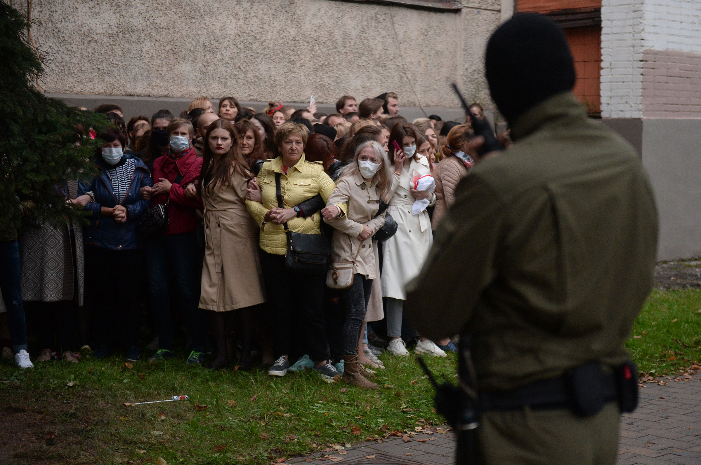 Activists resist an attempt by police to detain them while gathering to support opposition leader Maria Kolesnikova, who had been reportedly detained by state security agents, in Minsk on Sept. 8 2020.