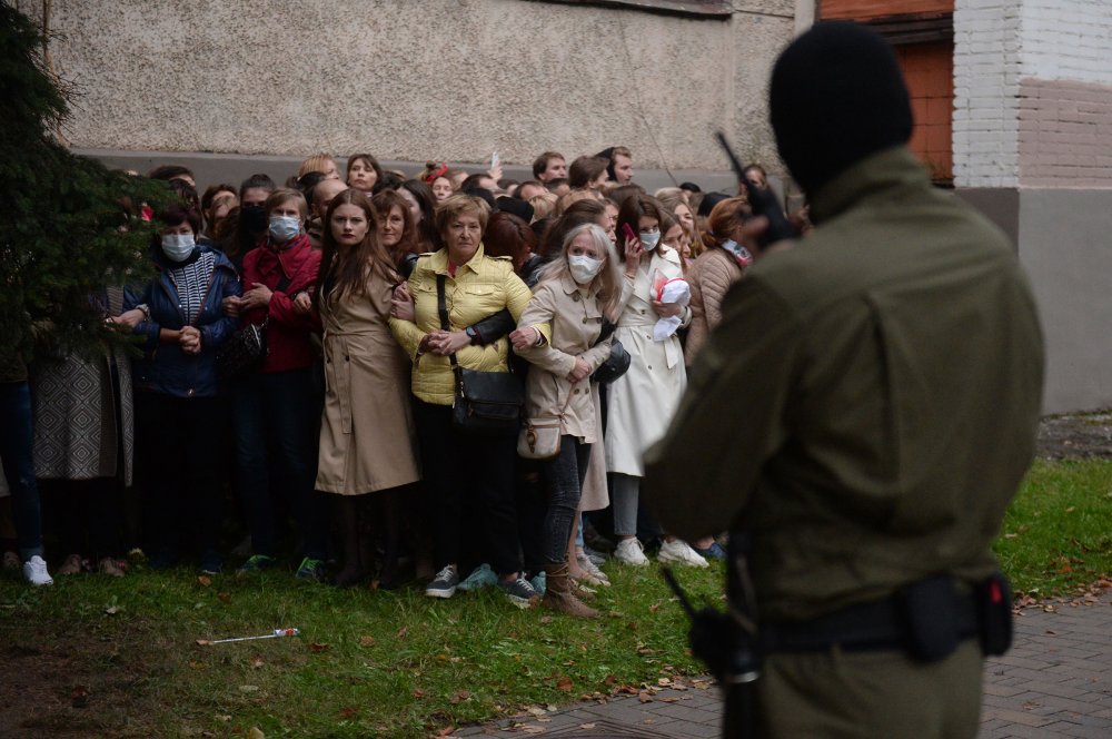 Activists resist an attempt by police to detain them while gathering to support opposition leader Maria Kolesnikova, who had been reportedly detained by state security agents, in Minsk on Sept. 8.