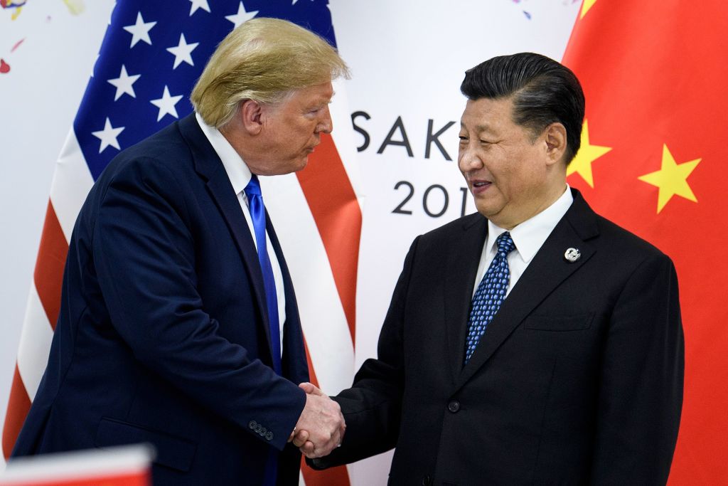 China's President Xi Jinping (R) shakes hands with President Donald Trump before a bilateral meeting on the sidelines of the G20 Summit in Osaka on June 28, 2019. (Brendan Smialowski—AFP/Getty Images)