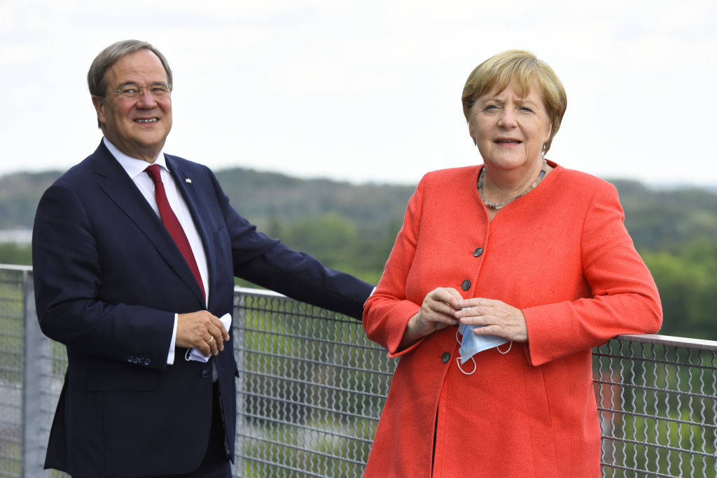 German Chancellor Angela Merkel and North Rhine-Westphalia Governor Armin Laschet visit the Ruhr Conference at the Zeche Zollverein former coal mine and coking plant on Aug. 18, 2020 in Essen, Germany. (Hauter/Pool/Getty Images)