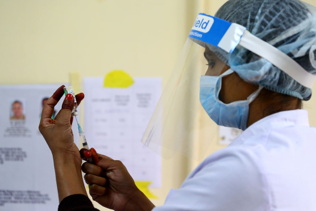 A medical worker inoculates a doctor with a COVID-19 coronavirus vaccine at the J.L.N Hospital in Ajmer, Rajasthan, India on 18 January 2021. (Himanshu Sharma/NurPhoto via Getty Images)