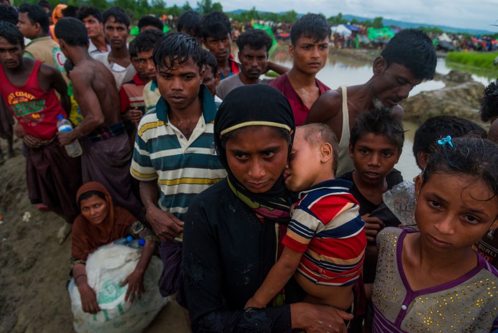 A large group of Rohingya people, fled from ongoing military operations in Myanmar's Rakhine state, try to cross the border at Palongkhalii, Cox's Bazar, Bangladesh, on October 17, 2017. (Stringer/Anadolu Agency/Getty Images)