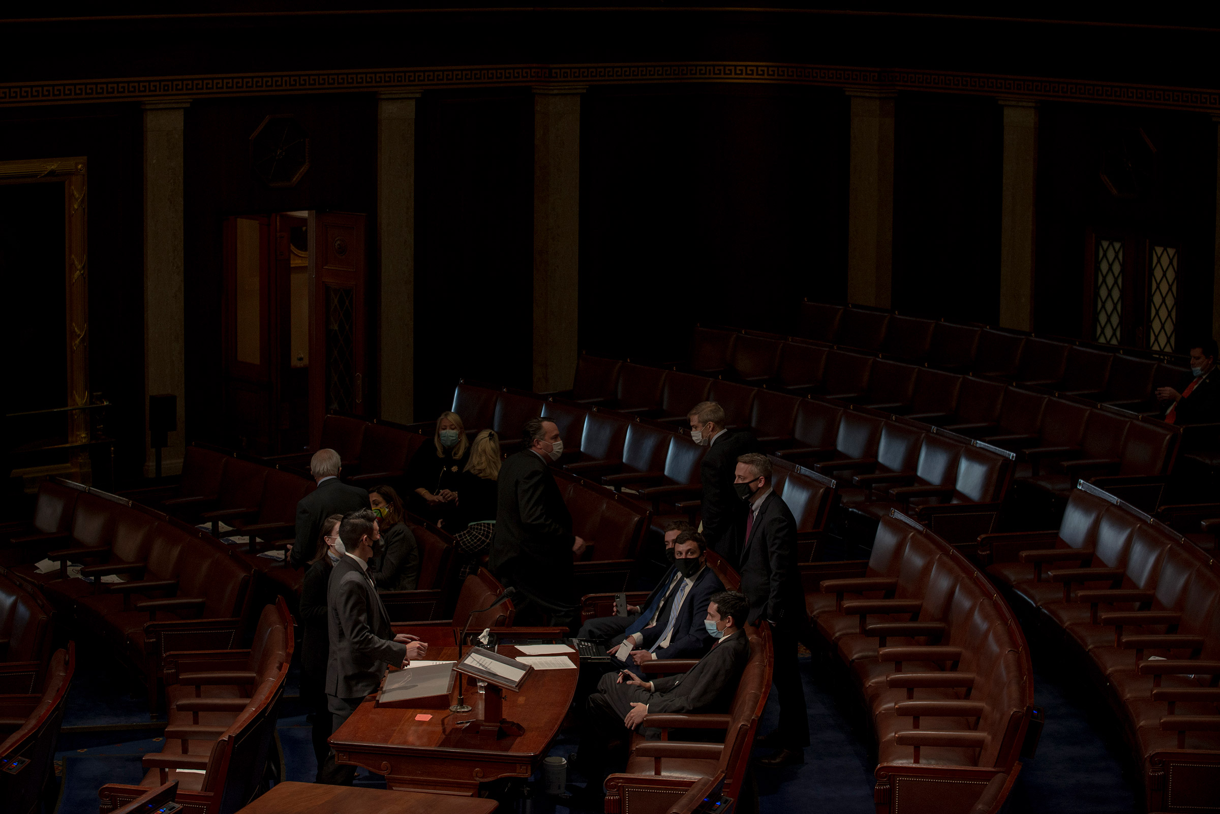 House Republicans huddle during the vote to impeach Trump on Jan. 13. (Gabriella Demczuk for TIME)