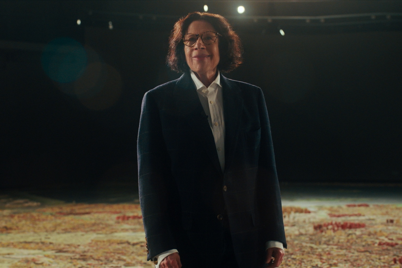 Fran Lebowitz stands above the Queens Museum’s scale model of the five boroughs in 'Pretend It's a City' (COURTESY OF NETFLIX)