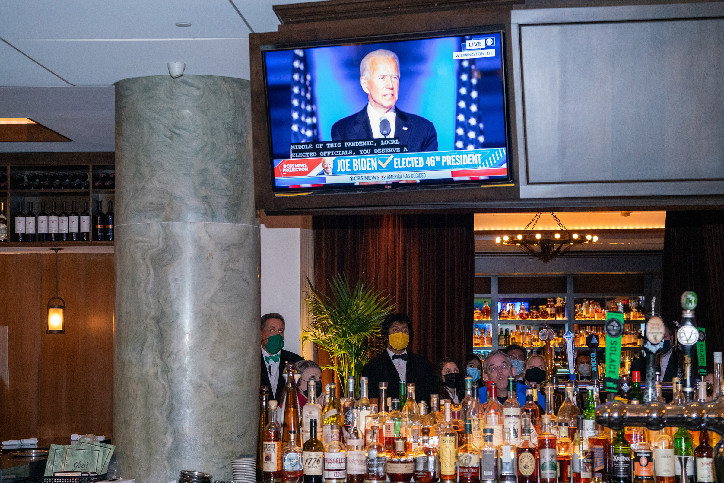 <strong>Washington, D.C., Nov. 7, 2020.</strong> People watch Biden’s first speech as President-elect at Joe's Seafood, Prime Steak &amp; Stone Crab. (Peter van Agtmael—Magnum Photos for TIME)