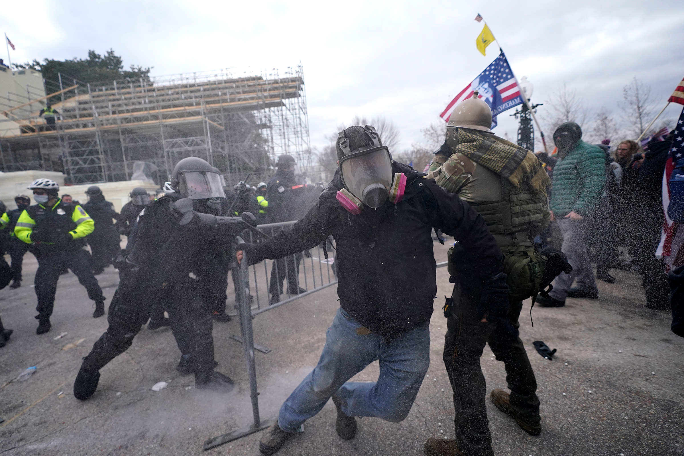 Trump supporters try to break through a police barrier at the Capitol in Washington, on Jan. 6, 2021. (Julio Cortez—AP)