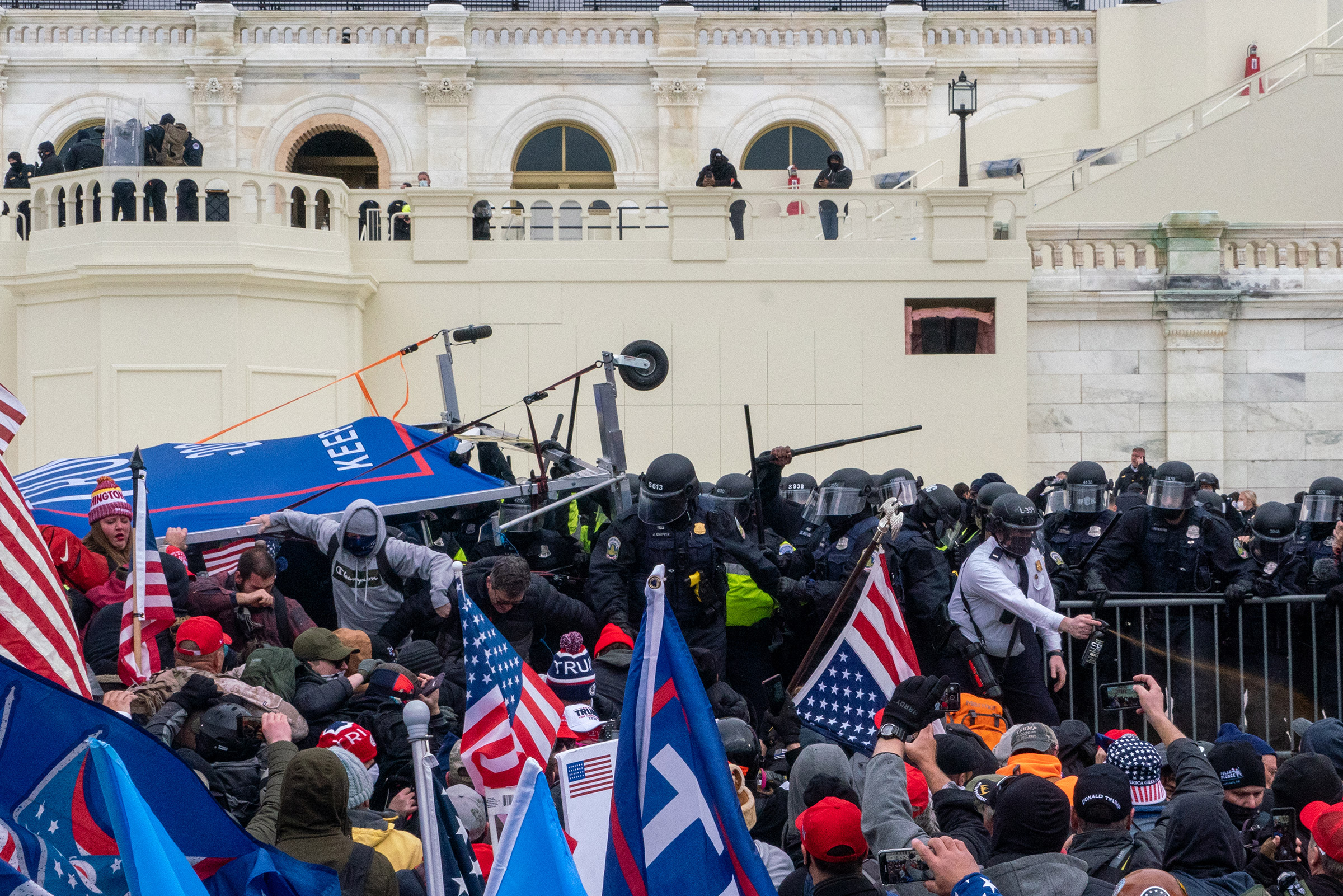 2020.Washington DC. USA. Protestors clash with police before gaining entry to the capitol. Following an inflammatory speech by President Trump, protestors objecting to the certification of Joe Biden by Congress storm the Capitol. They were briefly blocked by police before gaining entry, and wreaked havoc before being expelled with few arrests. One protestor was shot and killed.