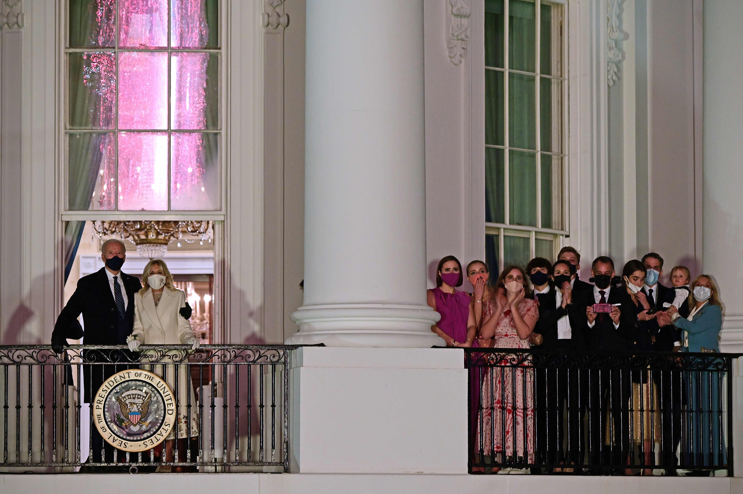 President Joe Biden, First Lady Dr. Jill Biden and family watch fireworks from the Blue Room Balcony of the White House.