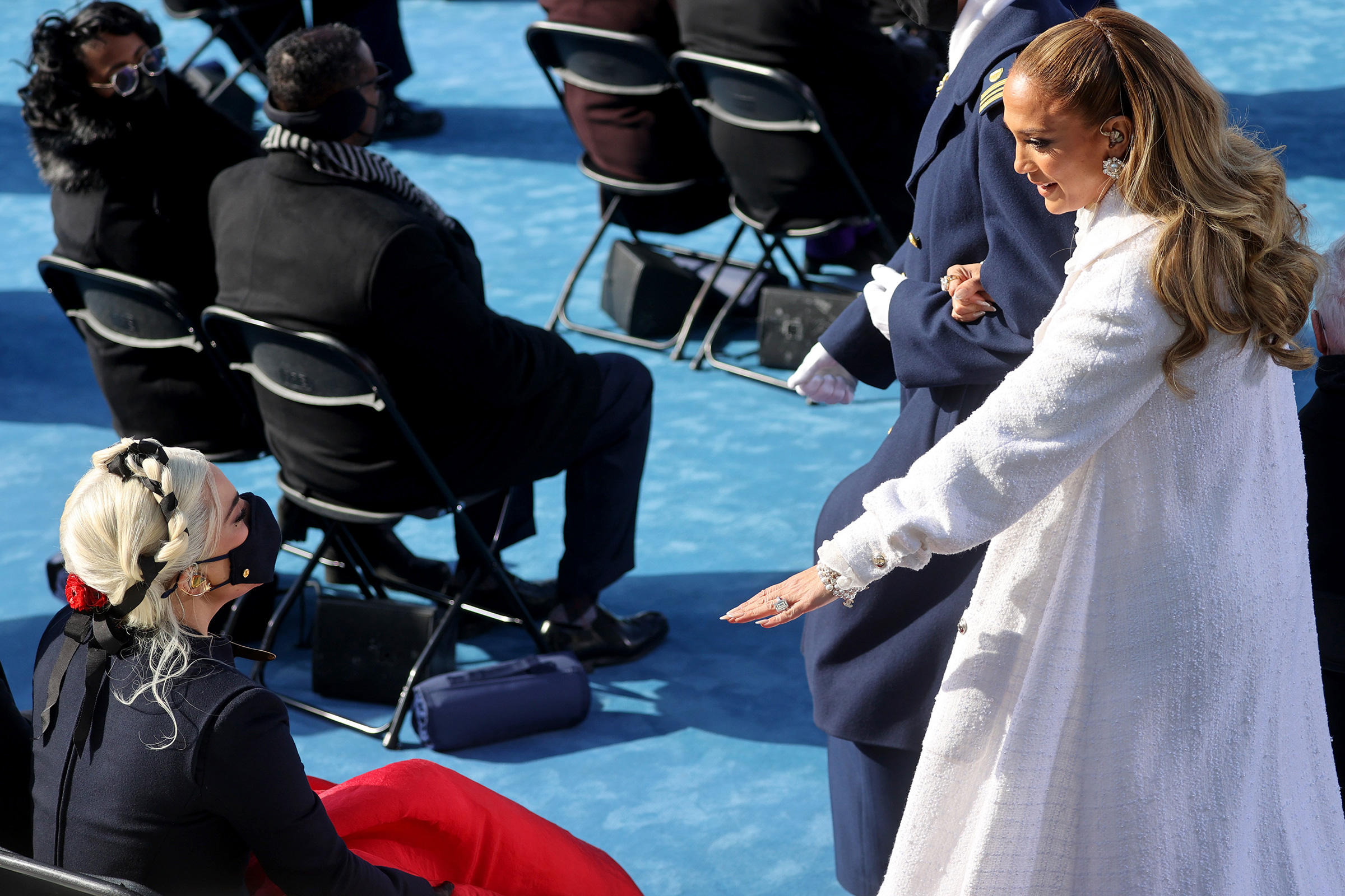 Jennifer Lopez, right, greets Lady Gaga during the 59th presidential inauguration.
