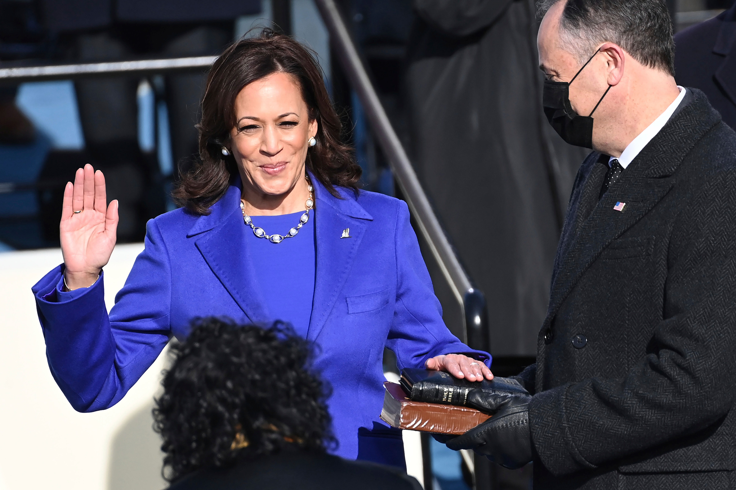 Kamala Harris is sworn in as vice president by Supreme Court Justice Sonia Sotomayor as her husband Doug Emhoff holds the Bible.