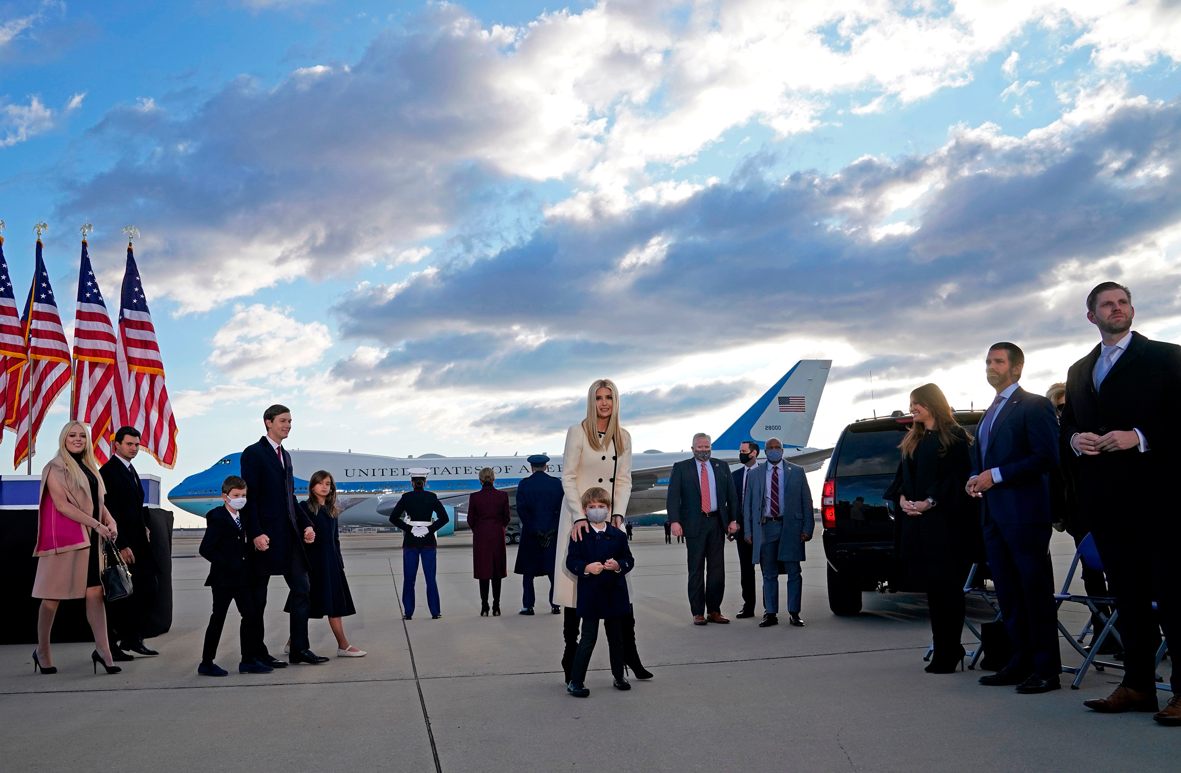 Trump family members stand on the tarmac at Joint Base Andrews in Maryland as they arrive for President Donald Trump's departure on Jan. 20. (Alex Edelman—AFP/Getty Images)