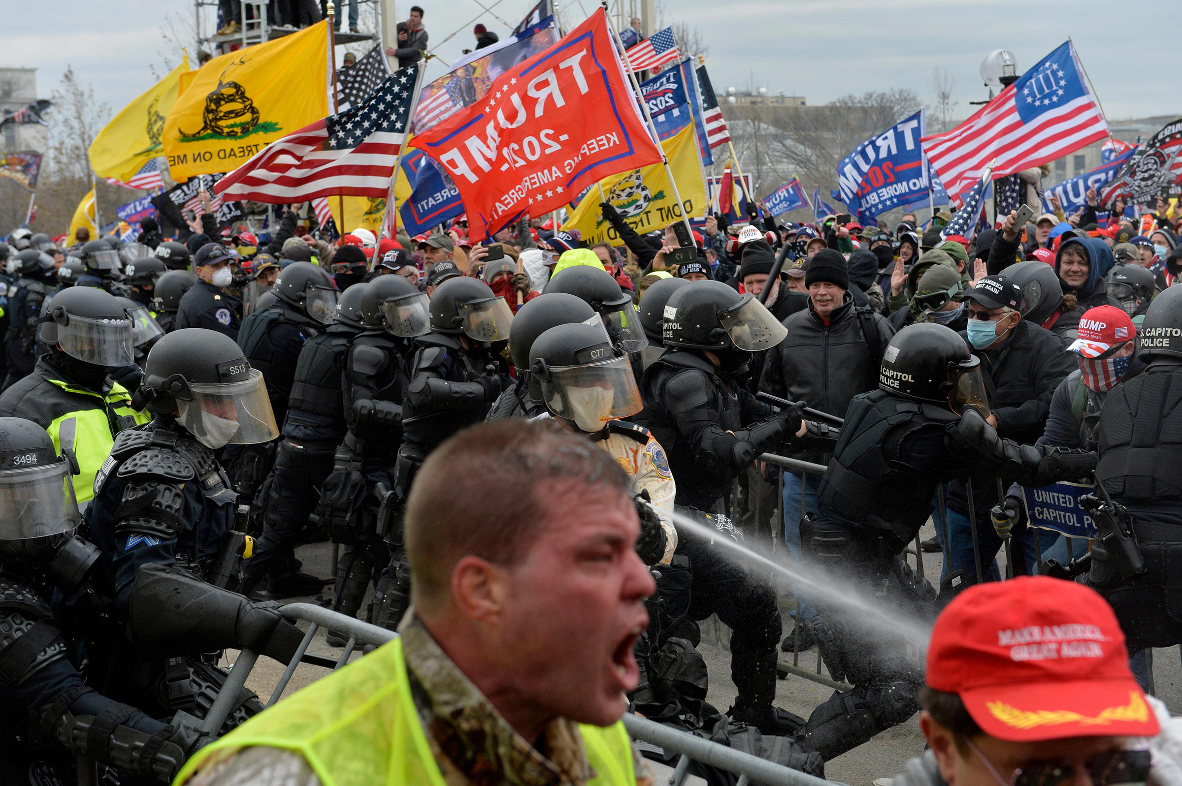 Trump supporters clash with police and security forces as people try to storm the Capitol building in Washington D.C. on Jan. 6, 2021.  (Joseph Prezioso—AFP/Getty Images)