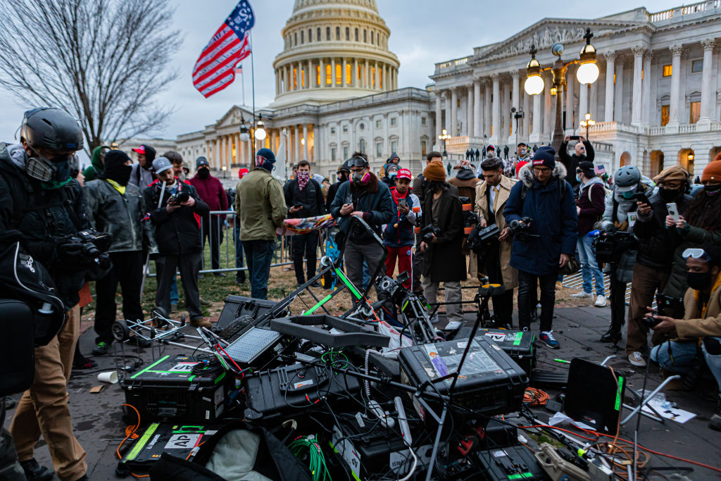 Pro-Trump protesters attacked the press pool outside the Capitol building and then destroyed their TV production gear. Pro-Trump supporters and far-right forces flooded Washington DC to protest Trump's election loss. (Photo by Michael Nigro/Pacific Press/LightRocket via Getty Images)