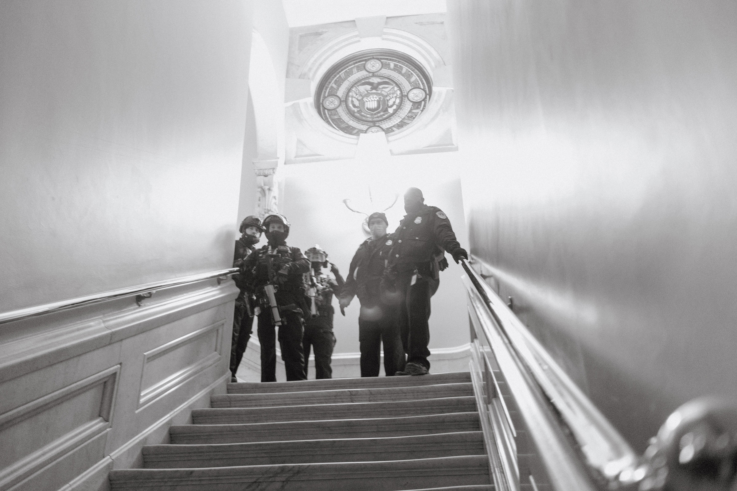 Capitol police seen at the top of a staircase inside the Capitol after a mob of Trump supporters broke in. (Christopher Lee for TIME)