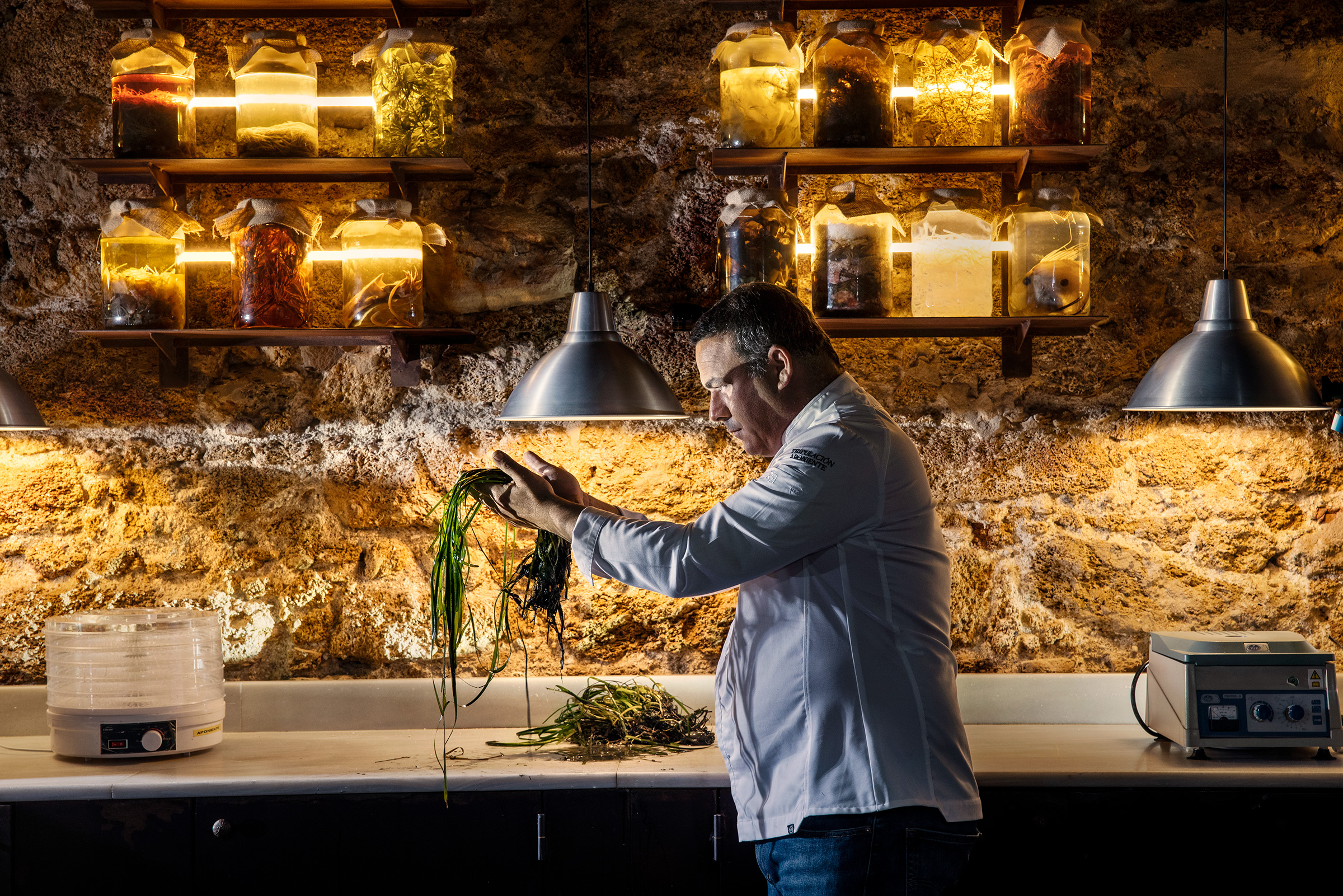 Chef Ángel León holding seagrass at his Michelin three-star seafood restaurant, Aponiente, in El Puerto de Santa María, Spain (Paolo Verzone—VU for TIME)