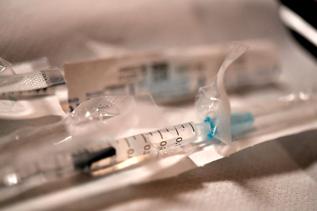 A syringe filled with a Covid-19 vaccine is ready to be delivered at a vaccination site in western France on Jan. 20, 2021. (Fred Tanneau/AFP—Getty Images)