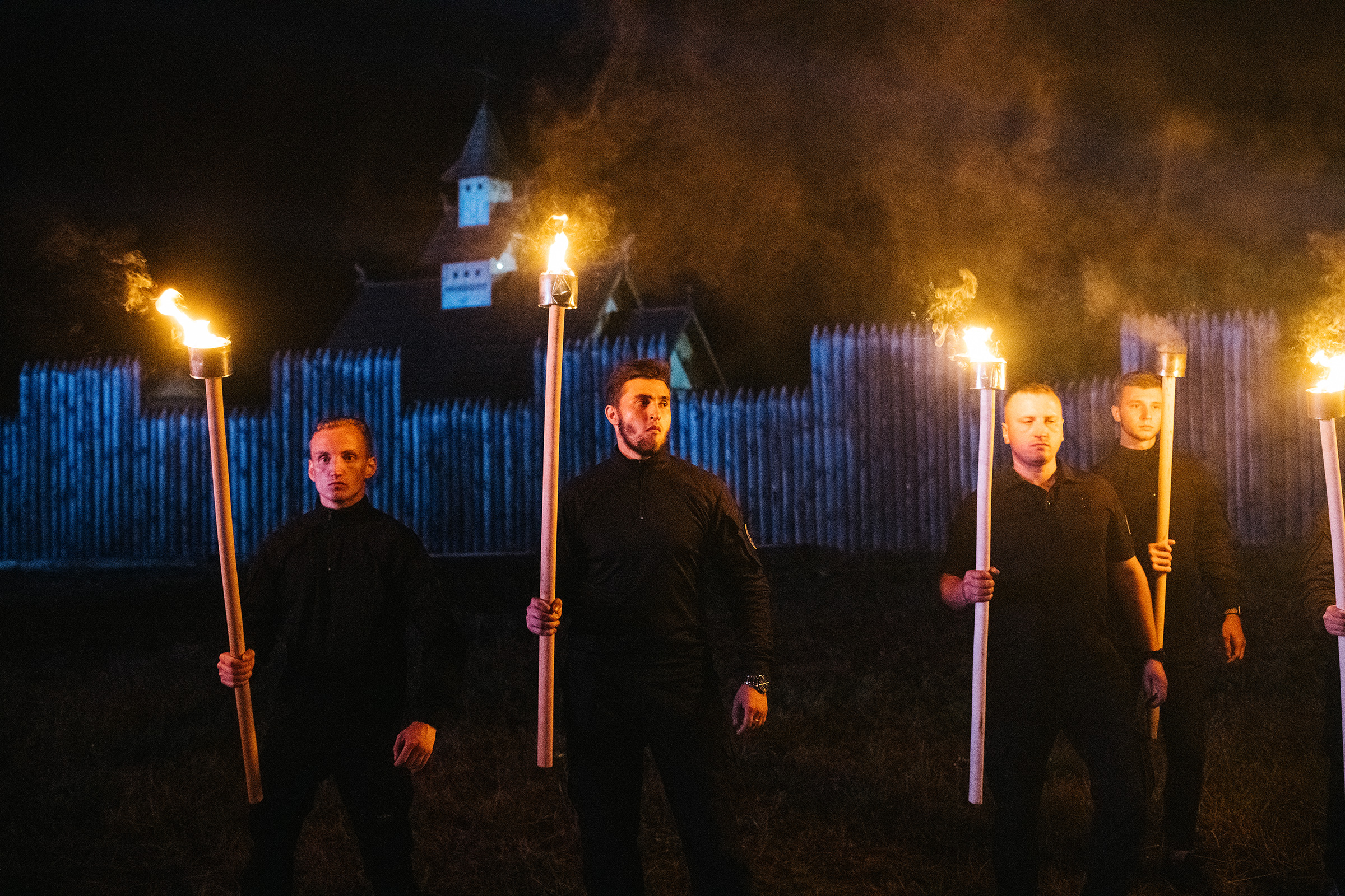 Azov members preparing to take part in a torchlit march at the Young Flame festival.