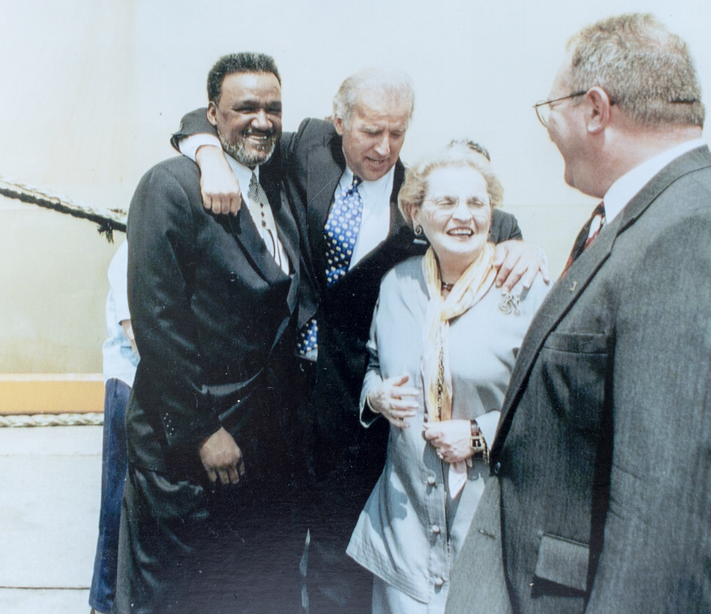 Richard "Mouse" Smith, left, with President Joe Biden, Madeleine Albright and Adam McBride sometime in the mid '90's. Smith is a Civil Rights leader in Delaware who has been friends with Biden since they were both young and when Biden was a lifeguard at the pool in Smith's neighborhood. Biden was best man at his wedding. (Andre Chung—The Washington Post/Getty Images)
